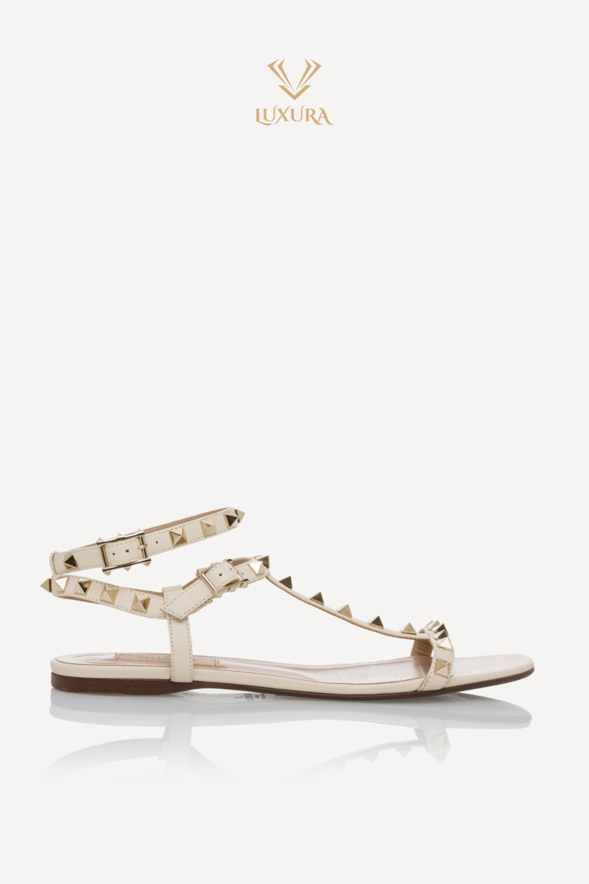 <span style="font-size: 10px; color: rgb(101, 101, 101);letter-spacing: .15em;">BEST DEAL</span><br><strong> VALENTINO </strong><br><div style="margin-top:10px; font-size:16px;">Rockstud Caged Flat Slide Sandals 38</div><br>