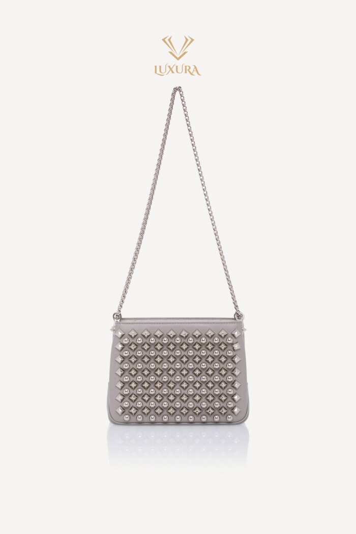 <span style="font-size: 10px; color: rgb(101, 101, 101);letter-spacing: .15em;">BEST DEAL</span><br><strong> CHRISTIAN LOUBOUTIN </strong><br><div style="margin-top:10px; font-size:16px;">Silver Leather Studded Triloubi Clutch Bag</div><br>