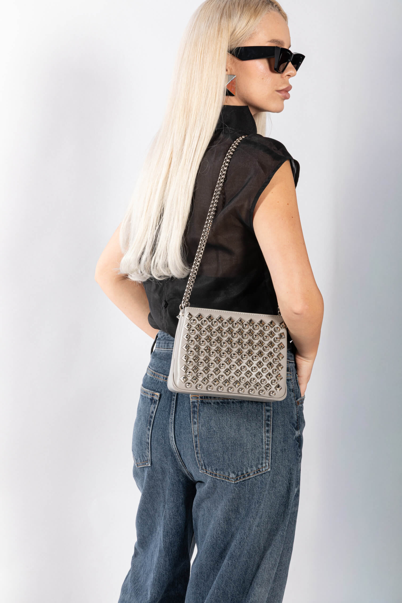 <span style="font-size: 10px; color: rgb(101, 101, 101);letter-spacing: .15em;">BEST DEAL</span><br><strong> CHRISTIAN LOUBOUTIN </strong><br><div style="margin-top:10px; font-size:16px;"> Silver Leather Studded Triloubi Clutch Bag </div><br> - Image 5