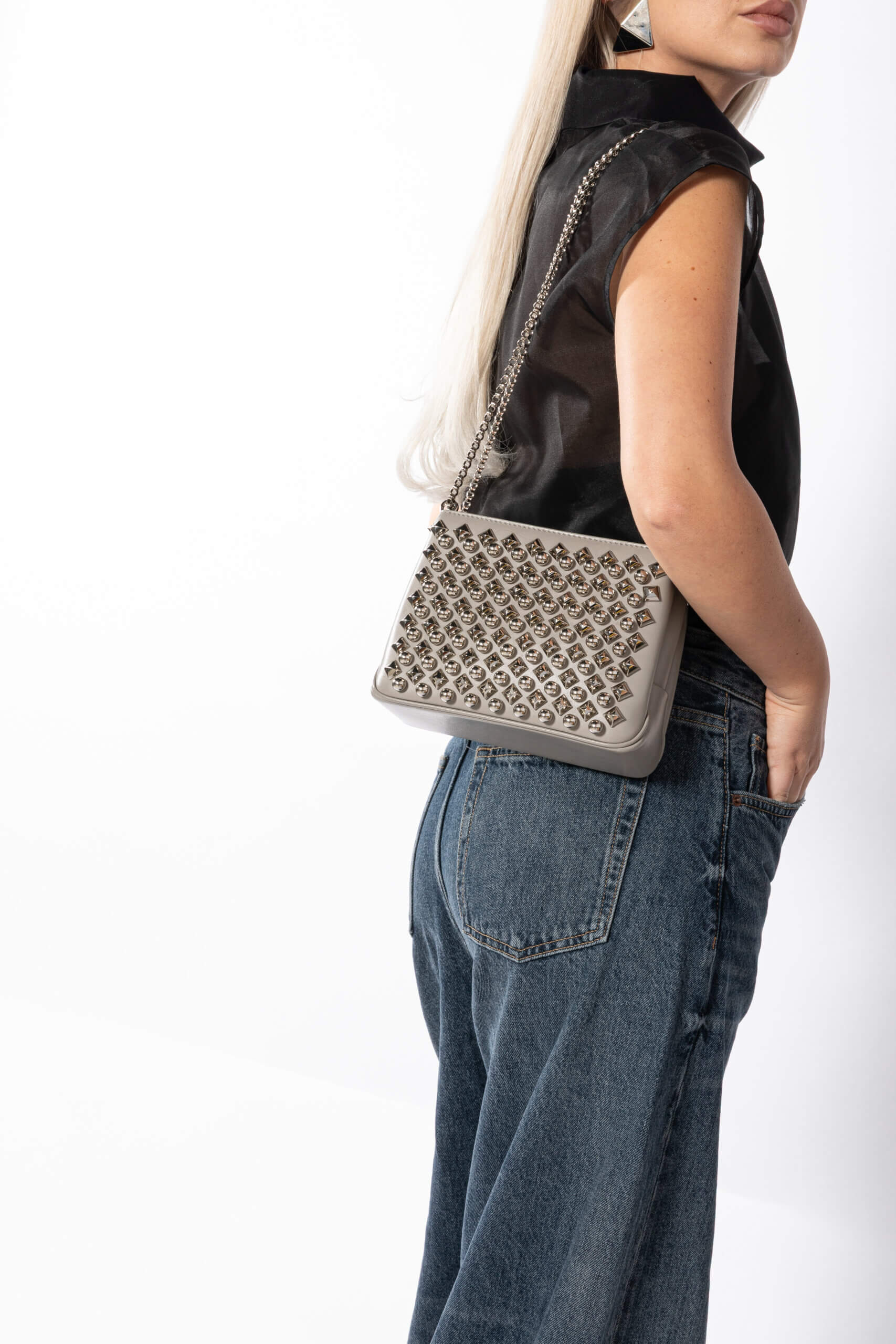 <span style="font-size: 10px; color: rgb(101, 101, 101);letter-spacing: .15em;">BEST DEAL</span><br><strong> CHRISTIAN LOUBOUTIN </strong><br><div style="margin-top:10px; font-size:16px;"> Silver Leather Studded Triloubi Clutch Bag </div><br> - Image 3