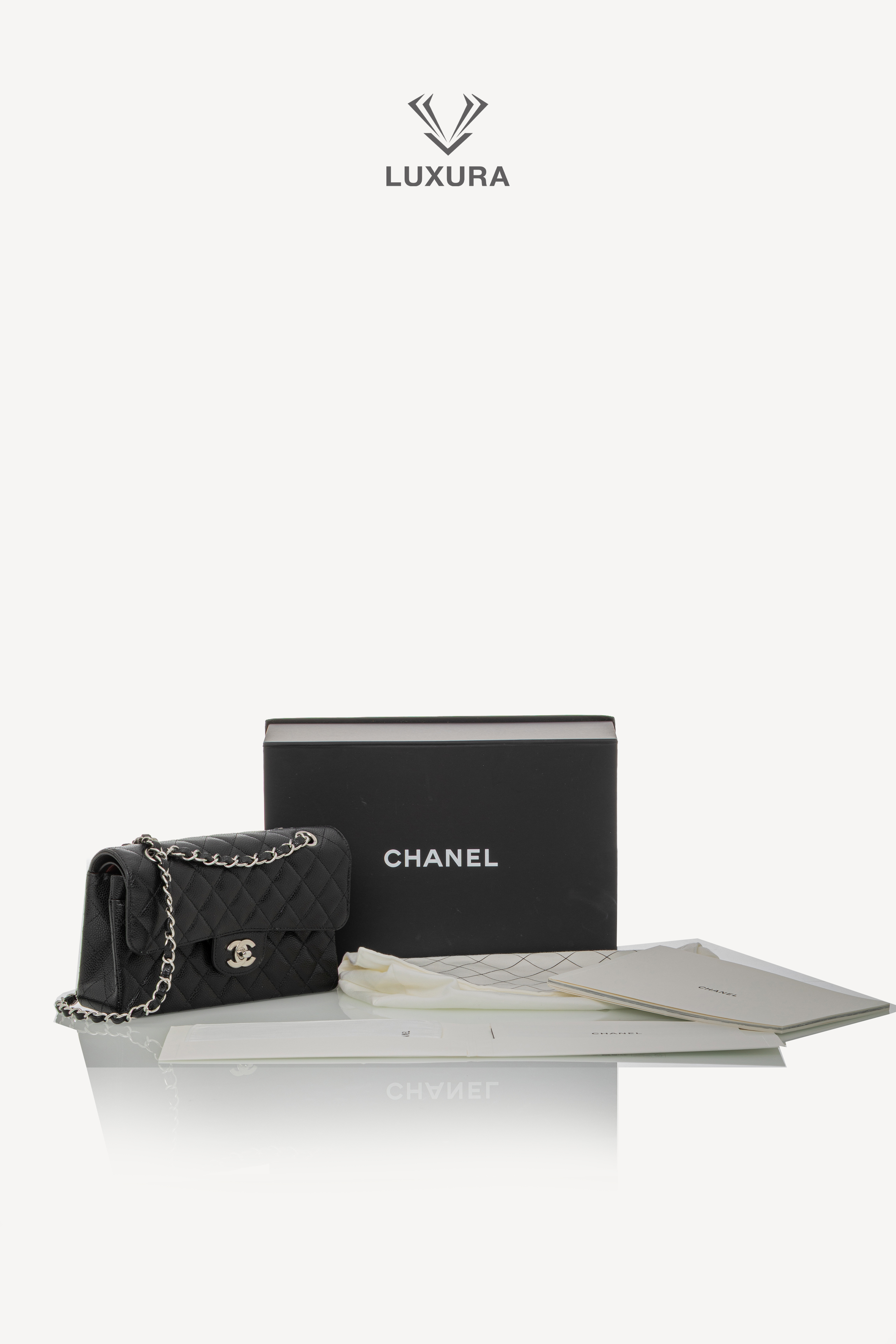 <span style="font-size: 10px;letter-spacing: .15em">HARD TO FIND</span><br>            <strong>CHANEL</strong><br>            <div style="margin-top:10px;font-size:16px">Caviar Quilted Small Double Flap Bag With silver Hardware</div><br> - Image 2