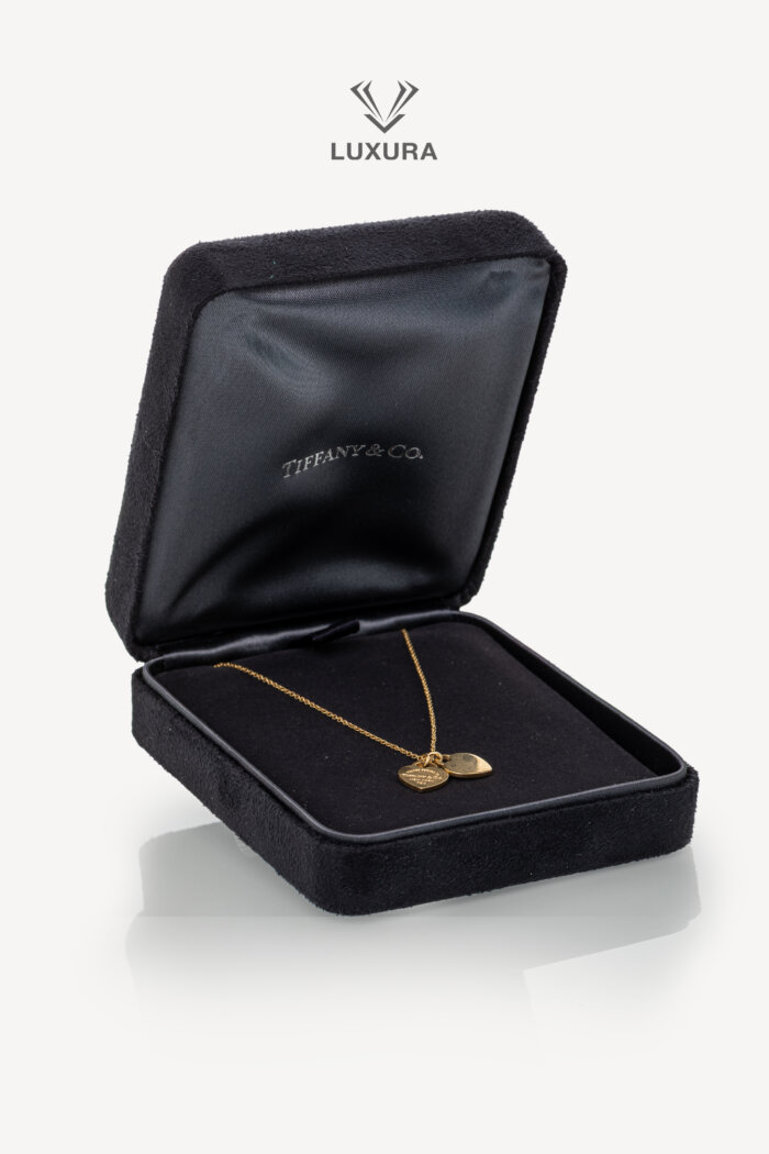 <span style="font-size: 10px;letter-spacing: .15em">HARD TO FIND</span><br>            <strong>TIFFANY & CO</strong><br>            <div style="margin-top:10px;font-size:16px">Return to Tiffany Double Heart Tag Pendant in Yellow Gold Mini</div><br>