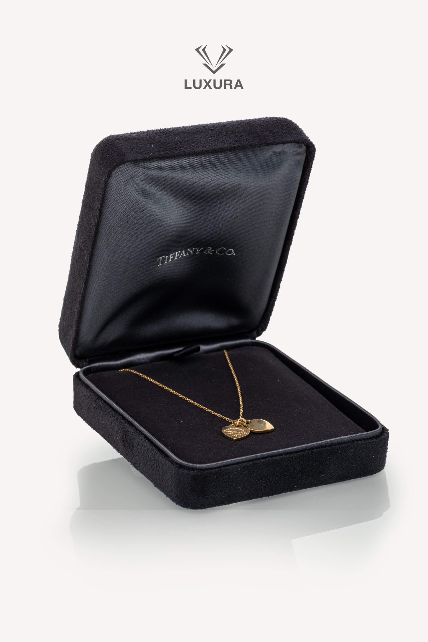 <span style="font-size: 10px;letter-spacing: .15em">HARD TO FIND</span><br>            <strong>TIFFANY & CO</strong><br>            <div style="margin-top:10px;font-size:16px">Return to Tiffany Double Heart Tag Pendant in Yellow Gold Mini</div><br>