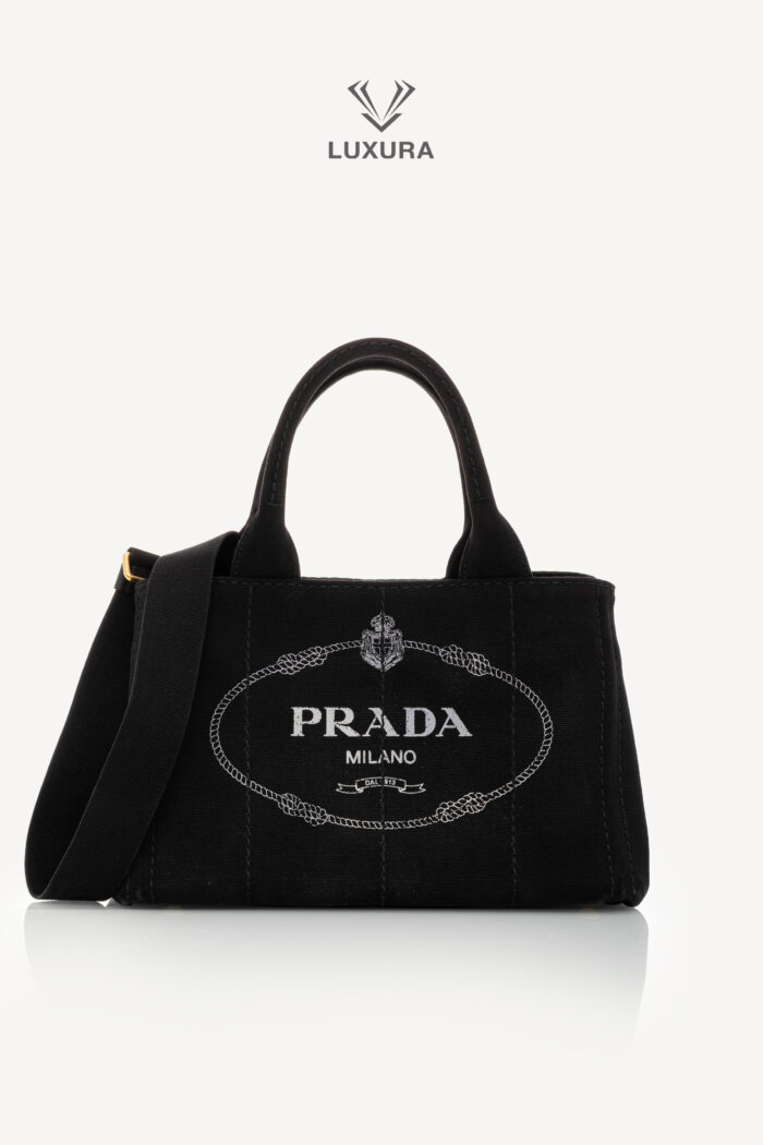 <span style="font-size: 10px;letter-spacing: .15em">HARD TO FIND</span><br>            <strong>PRADA</strong><br>            <div style="margin-top:10px;font-size:16px">Canapa Logo Tote Bag Black</div><br>