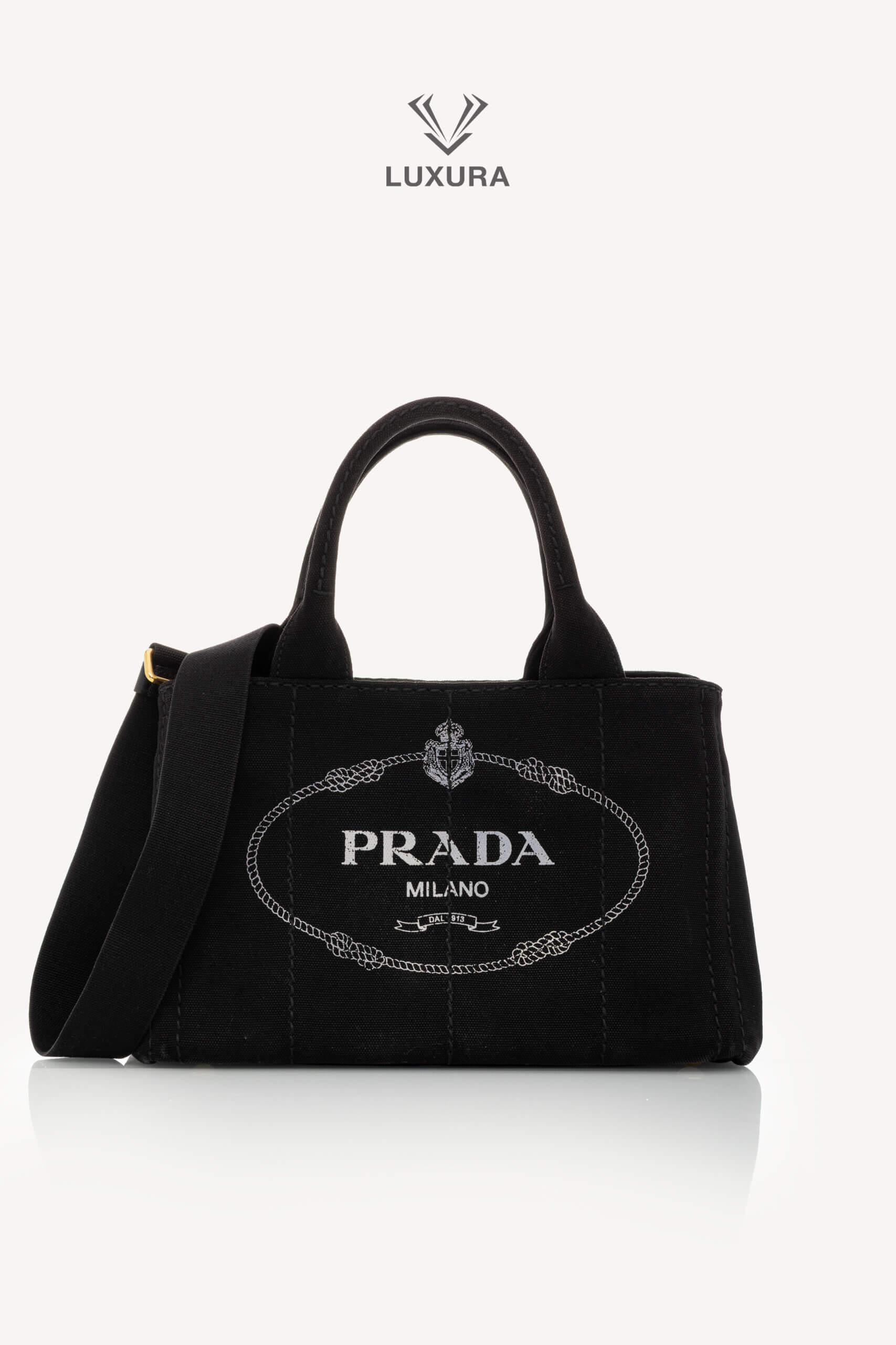 <span style="font-size: 10px;letter-spacing: .15em">HARD TO FIND</span><br> <strong>PRADA</strong><br> <div style="margin-top:10px;font-size:16px">Canapa Logo Tote Bag Black</div><br>