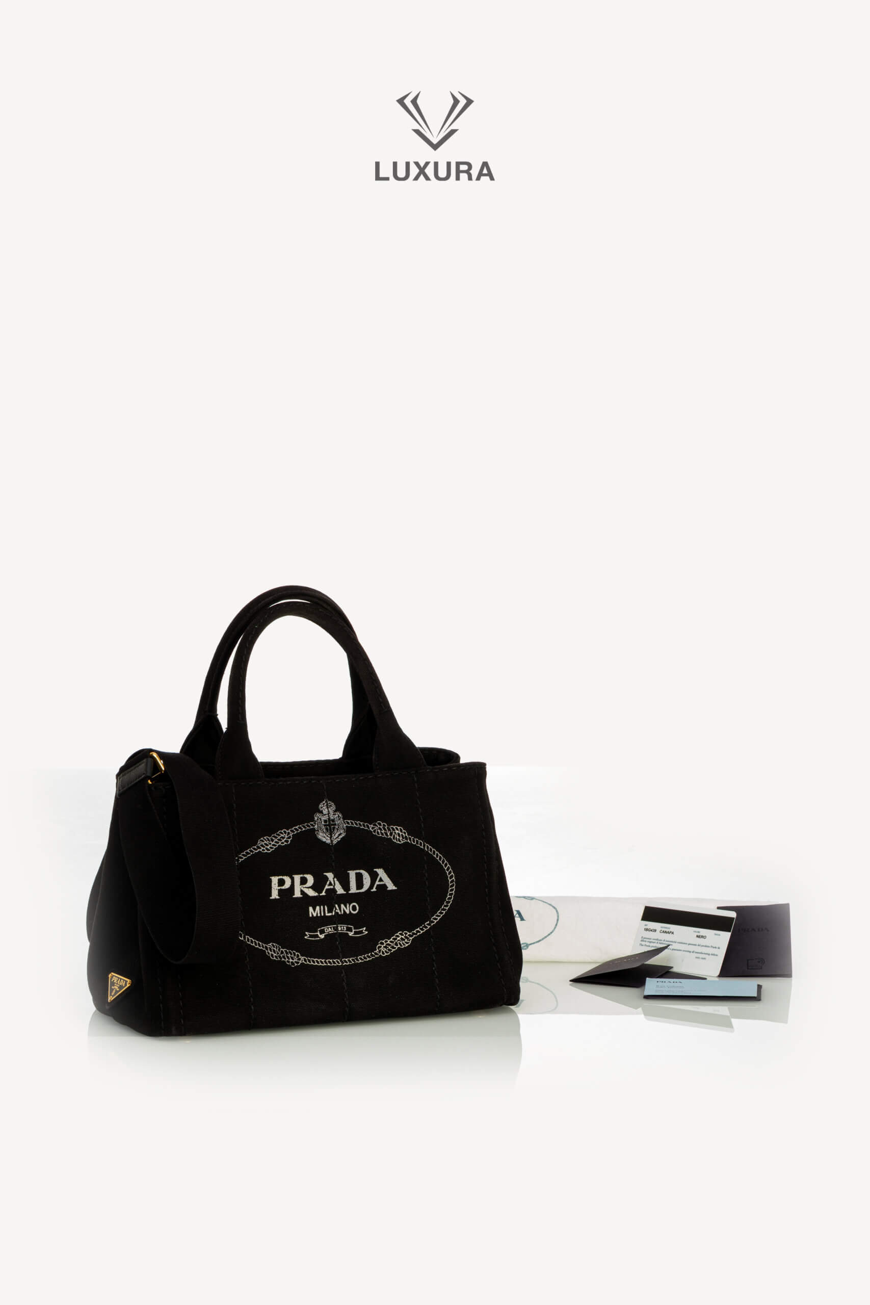 <span style="font-size: 10px;letter-spacing: .15em">HARD TO FIND</span><br> <strong>PRADA</strong><br> <div style="margin-top:10px;font-size:16px">Canapa Logo Tote Bag Black</div><br> - Image 2
