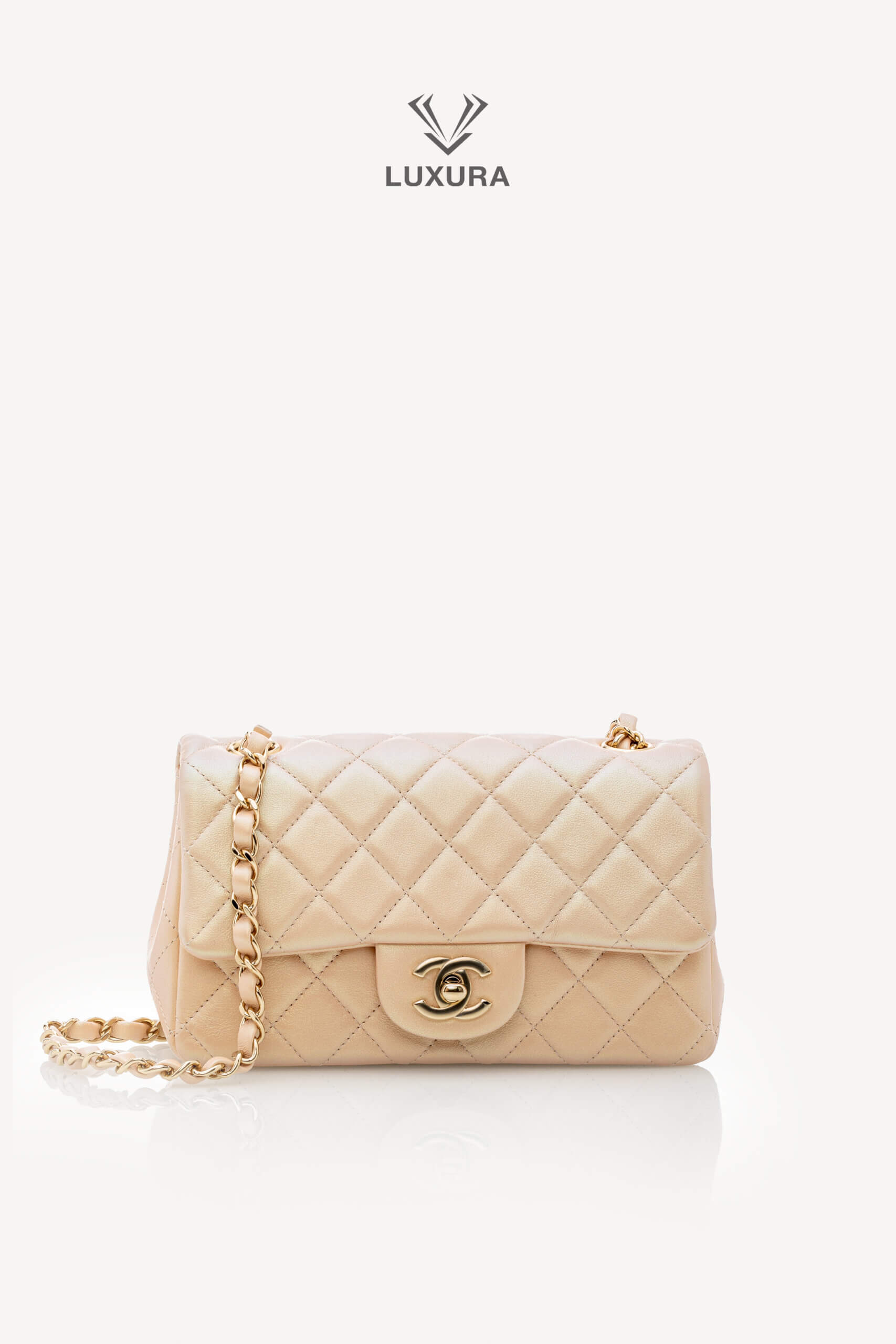 <span style="font-size: 10px;letter-spacing: .15em">HARD TO FIND</span><br>            <strong>CHANEL</strong><br>            <div style="margin-top:10px;font-size:16px">Classic Mini Rectangular Flap Bag Baby Pink Iridescent Lambskin Leather</div><br>