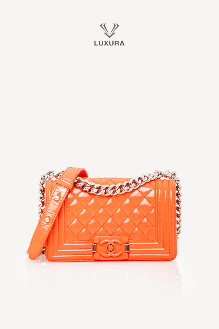 <span style="font-size: 10px;letter-spacing: .15em">HARD TO FIND</span><br>            <strong>CHANEL</strong><br>            <div style="margin-top:10px;font-size:16px">Boy Orange Patent Plexis Glass Silver Hardware Bag</div><br>