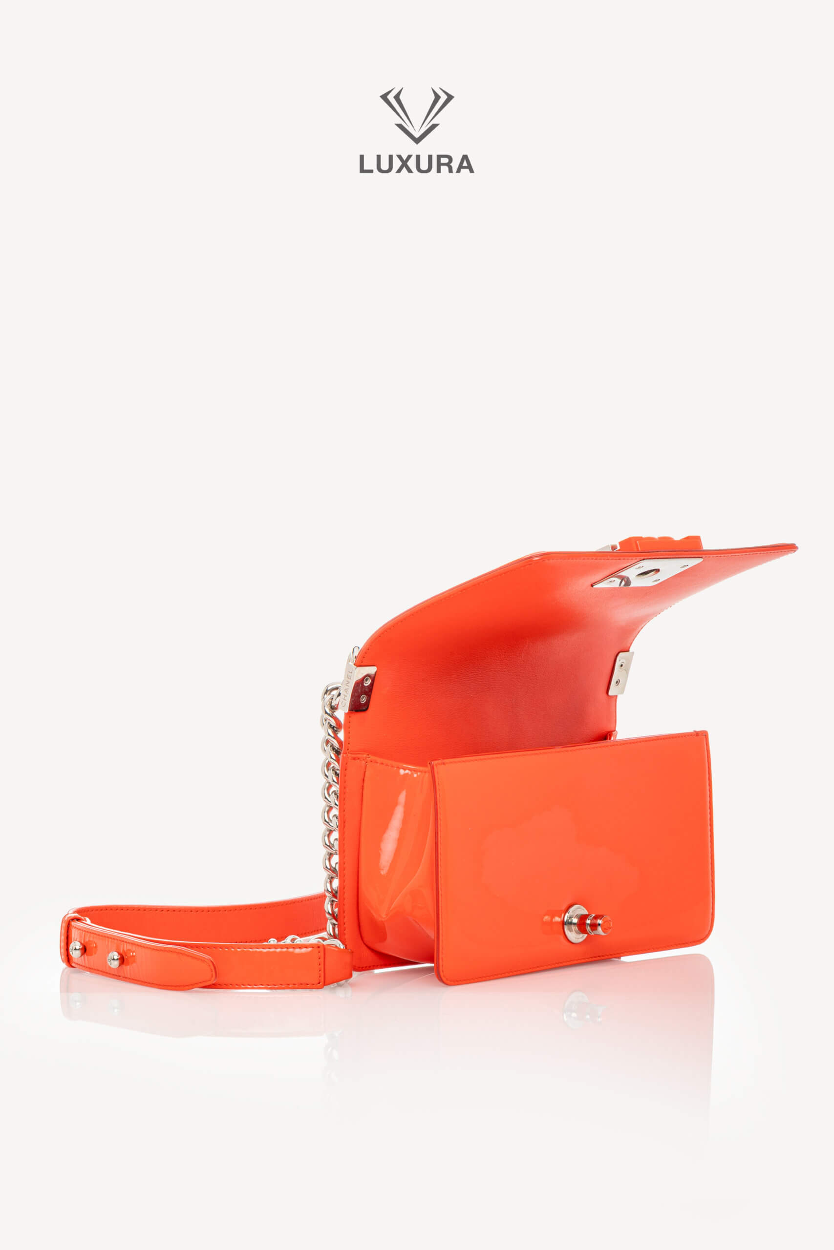 <span style="font-size: 10px;letter-spacing: .15em">HARD TO FIND</span><br>            <strong>CHANEL</strong><br>            <div style="margin-top:10px;font-size:16px">Boy Orange Patent Plexis Glass Silver Hardware Bag</div><br> - Image 11