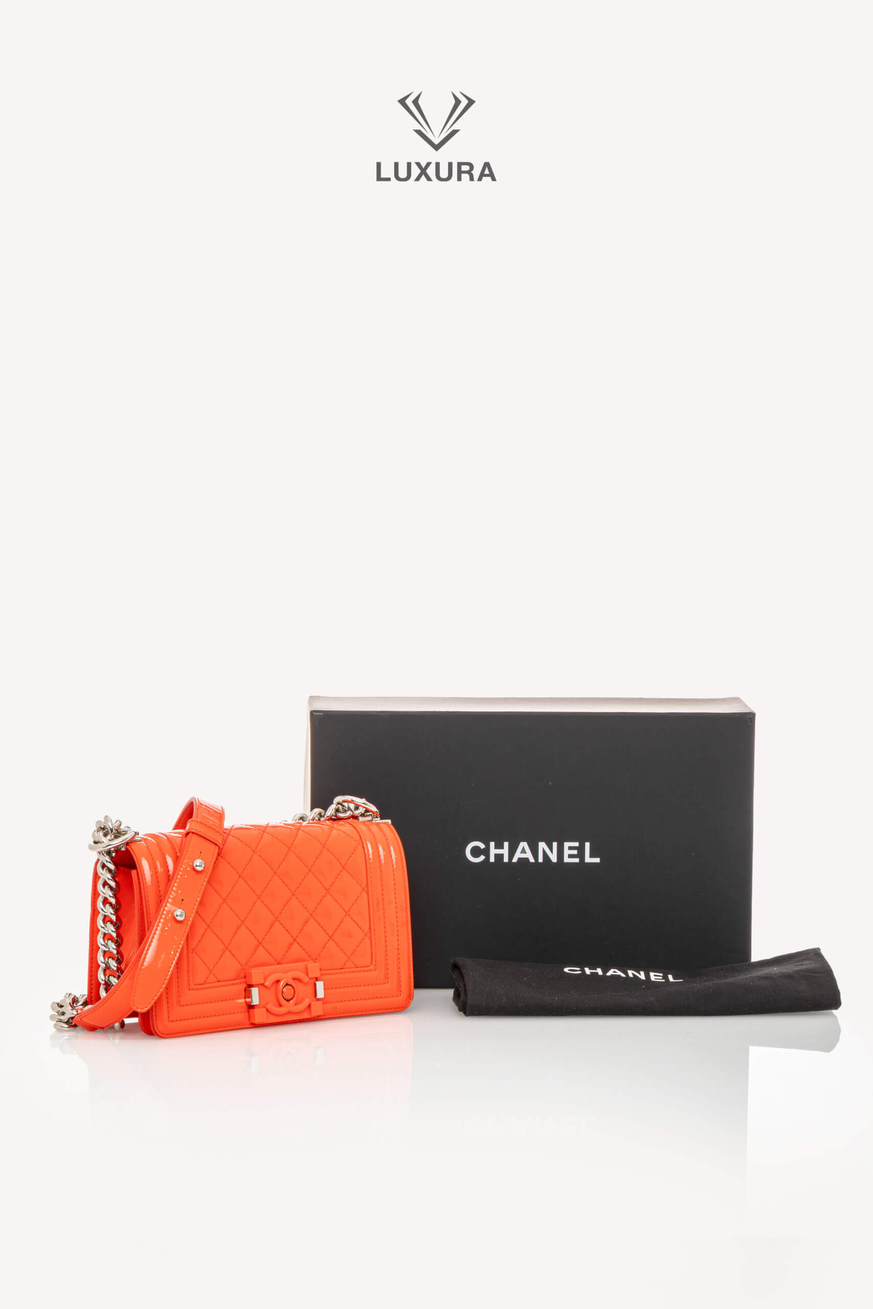 <span style="font-size: 10px;letter-spacing: .15em">HARD TO FIND</span><br>            <strong>CHANEL</strong><br>            <div style="margin-top:10px;font-size:16px">Boy Orange Patent Plexis Glass Silver Hardware Bag</div><br> - Image 5