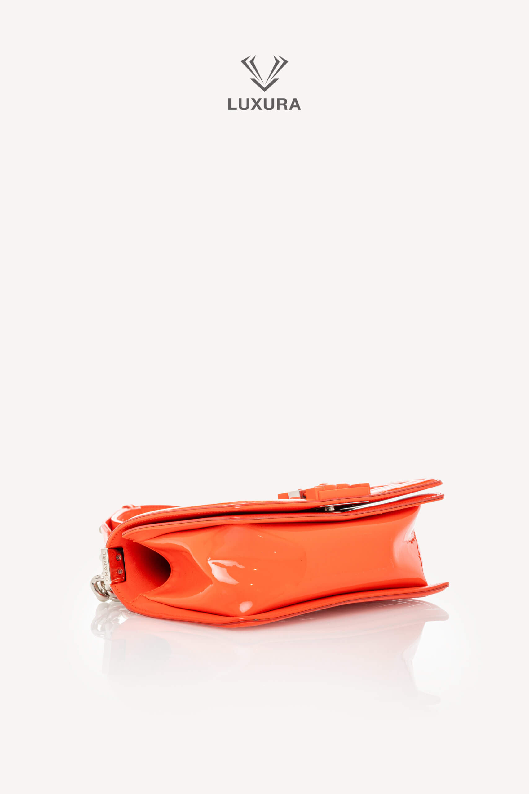 <span style="font-size: 10px;letter-spacing: .15em">HARD TO FIND</span><br>            <strong>CHANEL</strong><br>            <div style="margin-top:10px;font-size:16px">Boy Orange Patent Plexis Glass Silver Hardware Bag</div><br> - Image 27