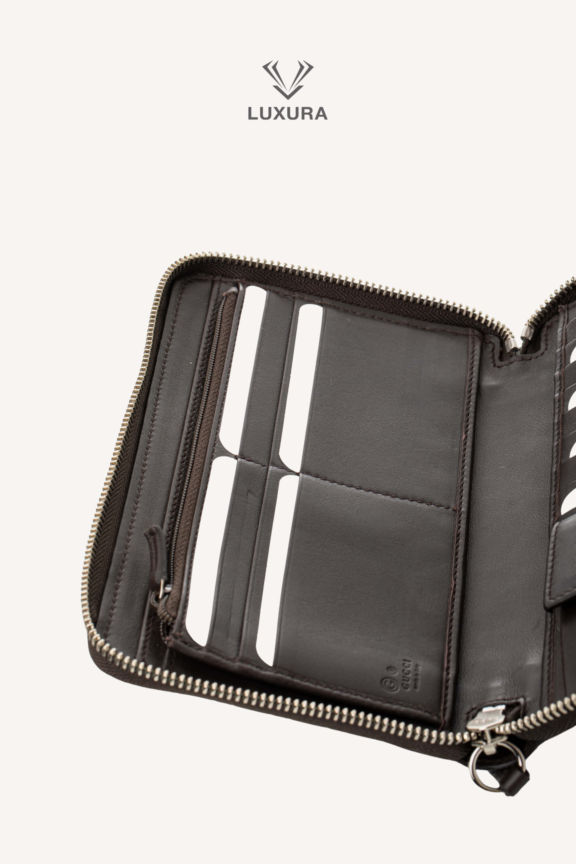 <span style="font-size: 10px;letter-spacing: .15em">BEST DEAL</span><br> <strong>GUCCI</strong><br> <div style="margin-top:10px;font-size:16px">Microguccissima Large Zip Around Organizer Wallet Brown</div><br> - Image 12