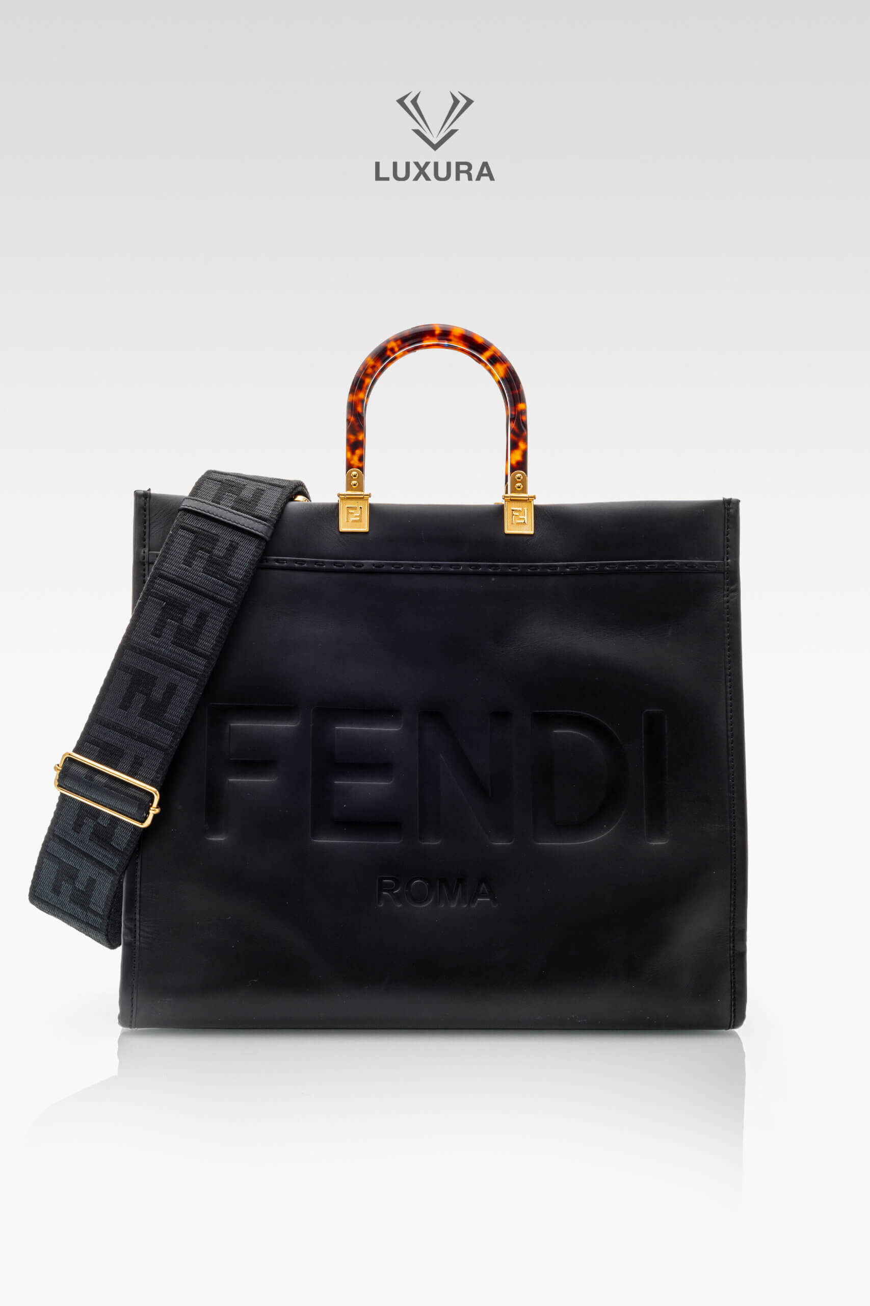 <span style="font-size: 10px;letter-spacing: .15em">BEST DEAL</span><br>            <strong>FENDI</strong><br>            <div style="margin-top:10px;font-size:16px">Sunshine Large Black Leather Shopper</div><br> - Image 2