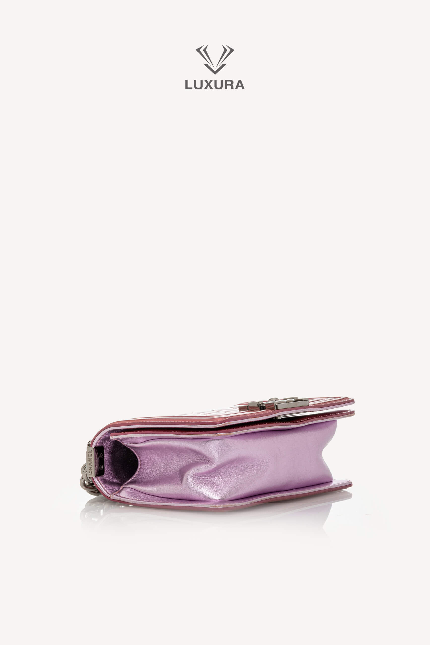 <span style="font-size: 10px;letter-spacing: .15em">HARD TO FIND</span><br>            <strong>CHANEL</strong><br>            <div style="margin-top:10px;font-size:16px">Leboy Small in Metallic Burgundy and Lavander Patent Calfskin Leather with Ruthenium Hardware</div><br> - Image 26