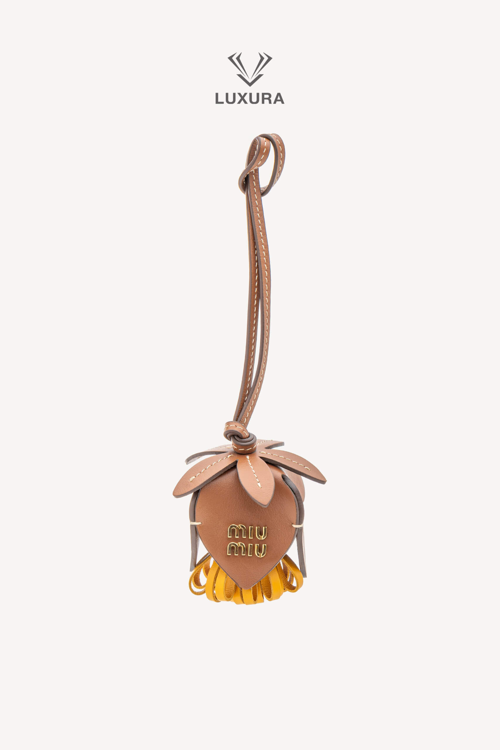 <span style="font-size: 10px;letter-spacing: .15em">HARD TO FIND</span><br>            <strong>MIU MIU</strong><br>            <div style="margin-top:10px;font-size:16px">Calfskin Trick Bag Charm Brown-Mustard Yellow</div><br>