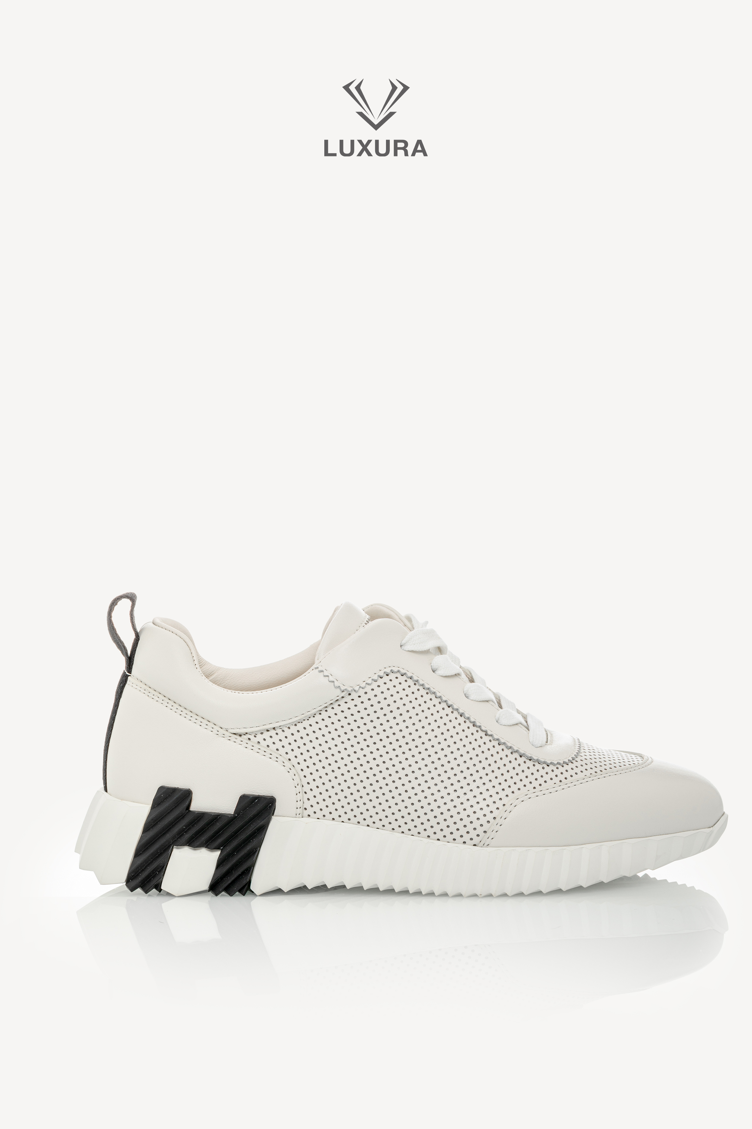 <span style="font-size: 10px;letter-spacing: .15em"></span><br>            <strong>HERMES</strong><br>            <div style="margin-top:10px;font-size:16px">Bouncing Sneaker in Perforated Calfskin Ecru 37.5</div><br>