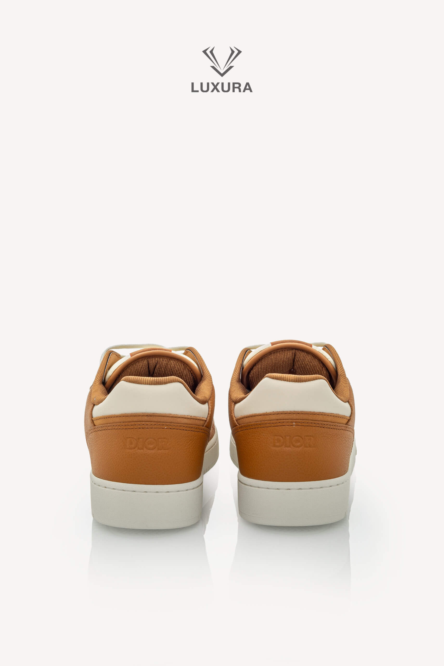 <span style="font-size: 10px;letter-spacing: .15em">NEW COLLECTION</span><br>            <strong>DIOR</strong><br>            <div style="margin-top:10px;font-size:16px">B27 Uptown Low-Top Sneaker Cognac and White with White Dior Gravity Leather 44 </div><br> - Image 7
