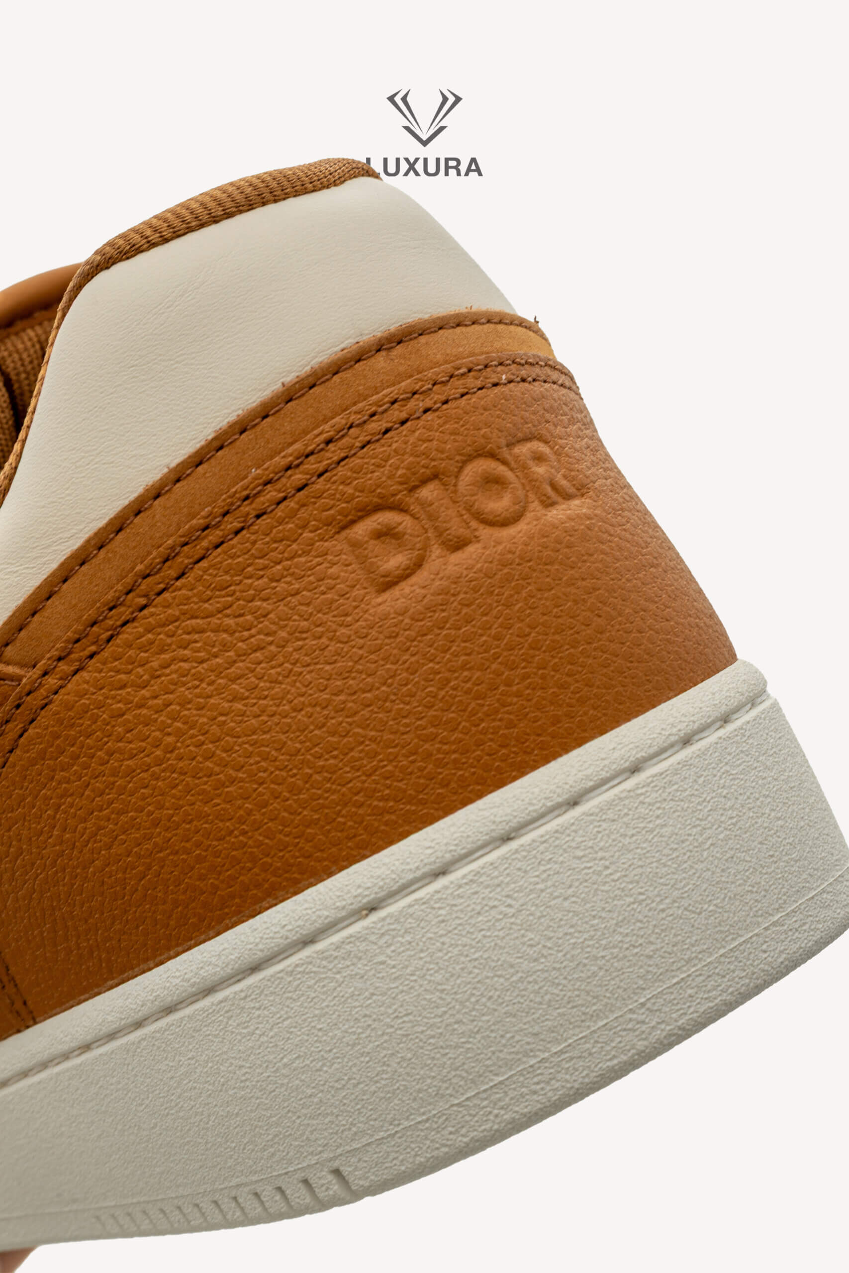 <span style="font-size: 10px;letter-spacing: .15em">NEW COLLECTION</span><br>            <strong>DIOR</strong><br>            <div style="margin-top:10px;font-size:16px">B27 Uptown Low-Top Sneaker Cognac and White with White Dior Gravity Leather 44 </div><br> - Image 17