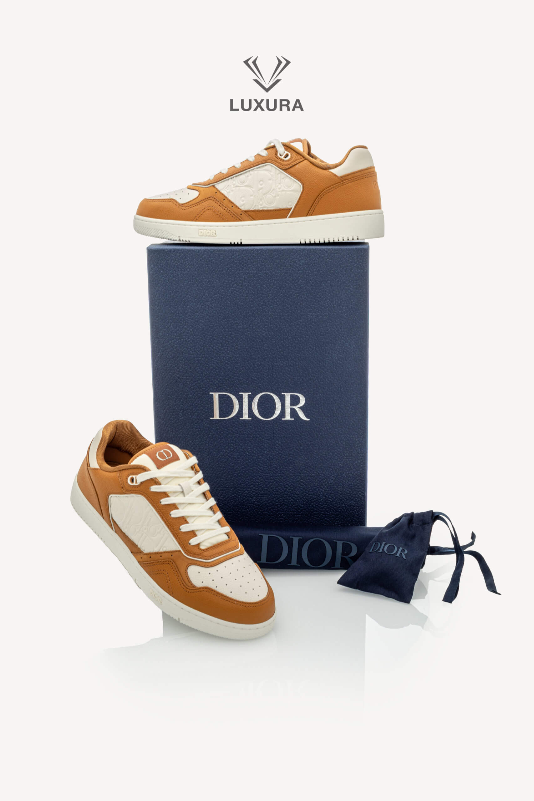 <span style="font-size: 10px;letter-spacing: .15em">NEW COLLECTION</span><br>            <strong>DIOR</strong><br>            <div style="margin-top:10px;font-size:16px">B27 Uptown Low-Top Sneaker Cognac and White with White Dior Gravity Leather 44 </div><br> - Image 2