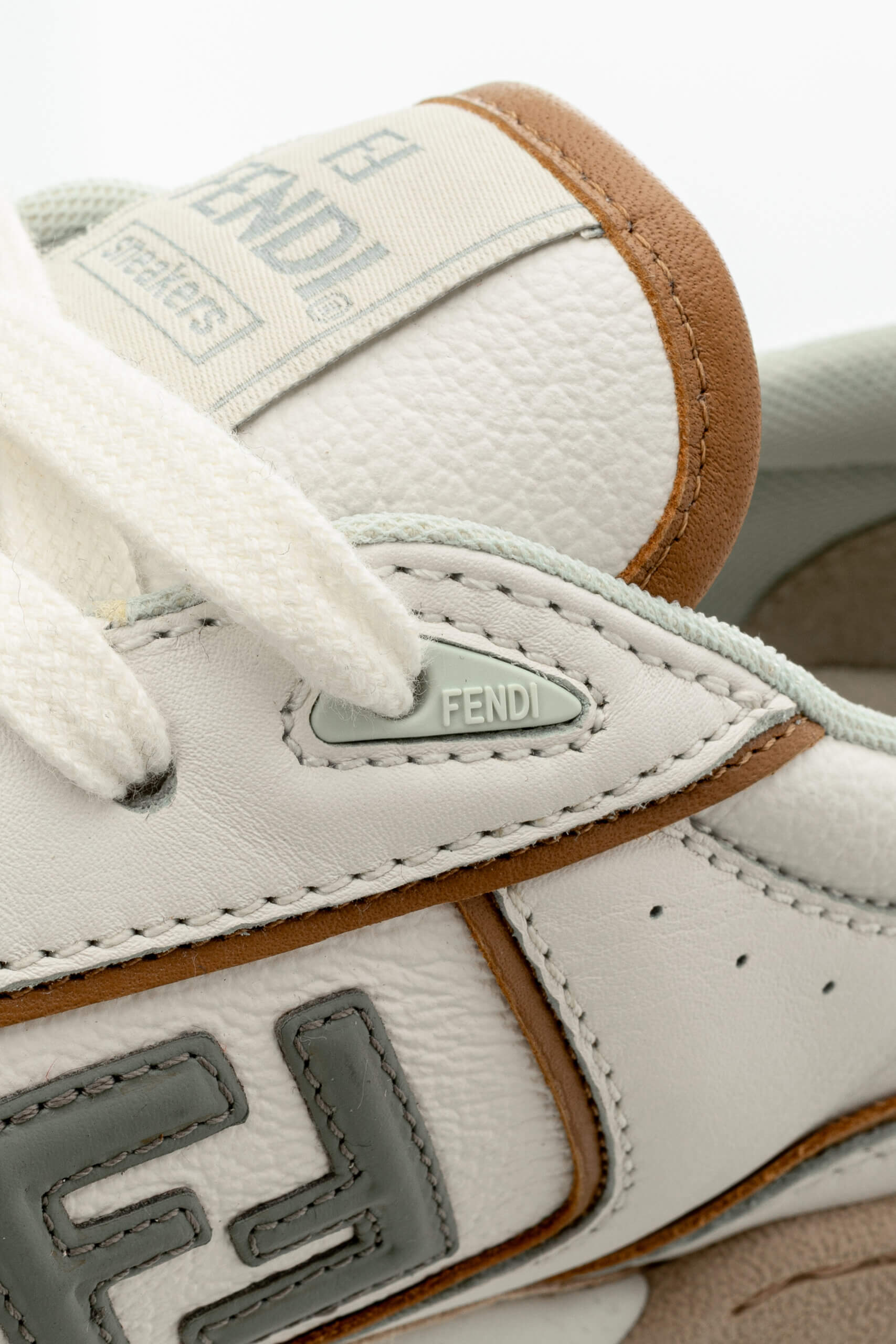 <span style="font-size: 10px;letter-spacing: .15em">NEW COLLECTION</span><br>            <strong>FENDI</strong><br>            <div style="margin-top:10px;font-size:16px">Match White and Brown leather and suede low tops 37</div><br> - Image 16