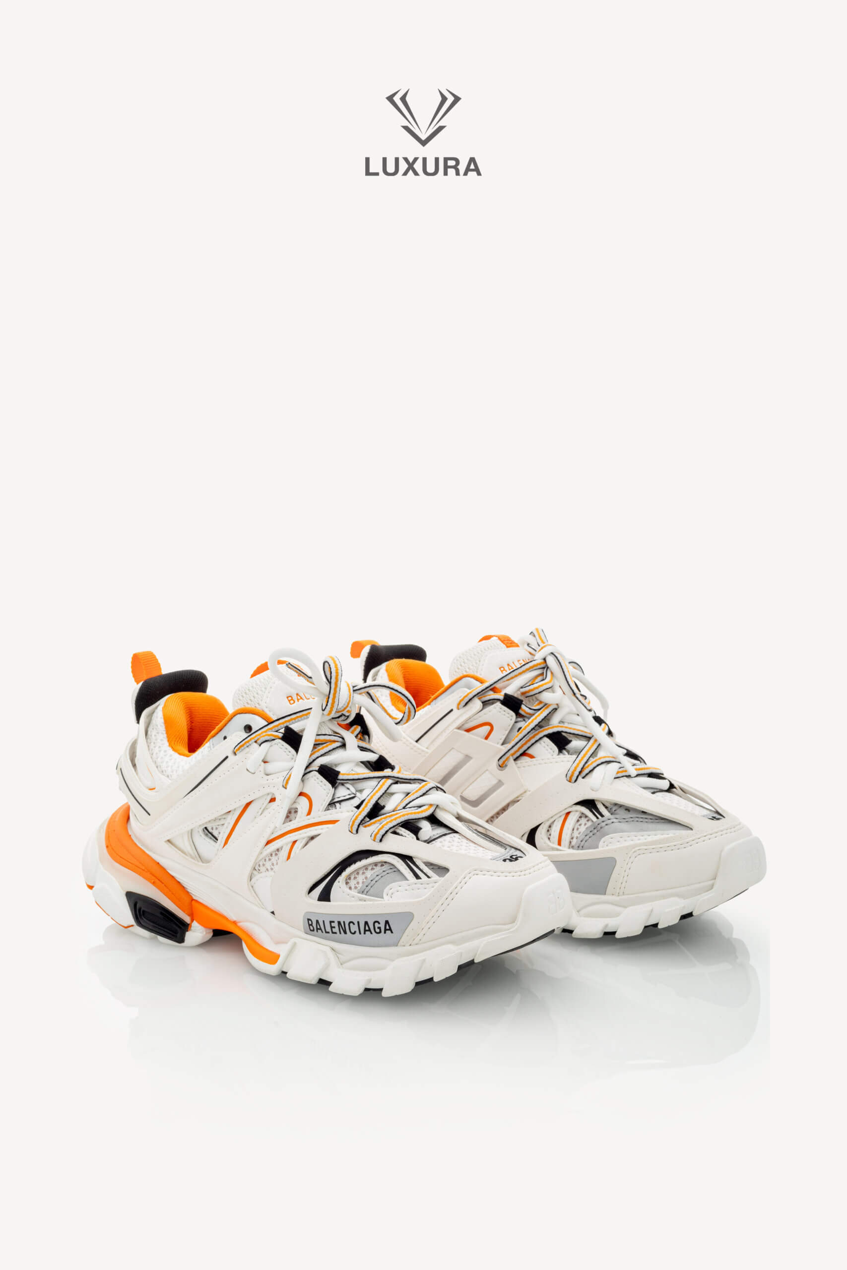 <span style="font-size: 10px;letter-spacing: .15em">IN TRENDING</span><br>            <strong>BALENCIAGA</strong><br>            <div style="margin-top:10px;font-size:16px">Track Sneakers in White and Orange Mesh and Nylon 36 [EXT]</div><br> - Image 5