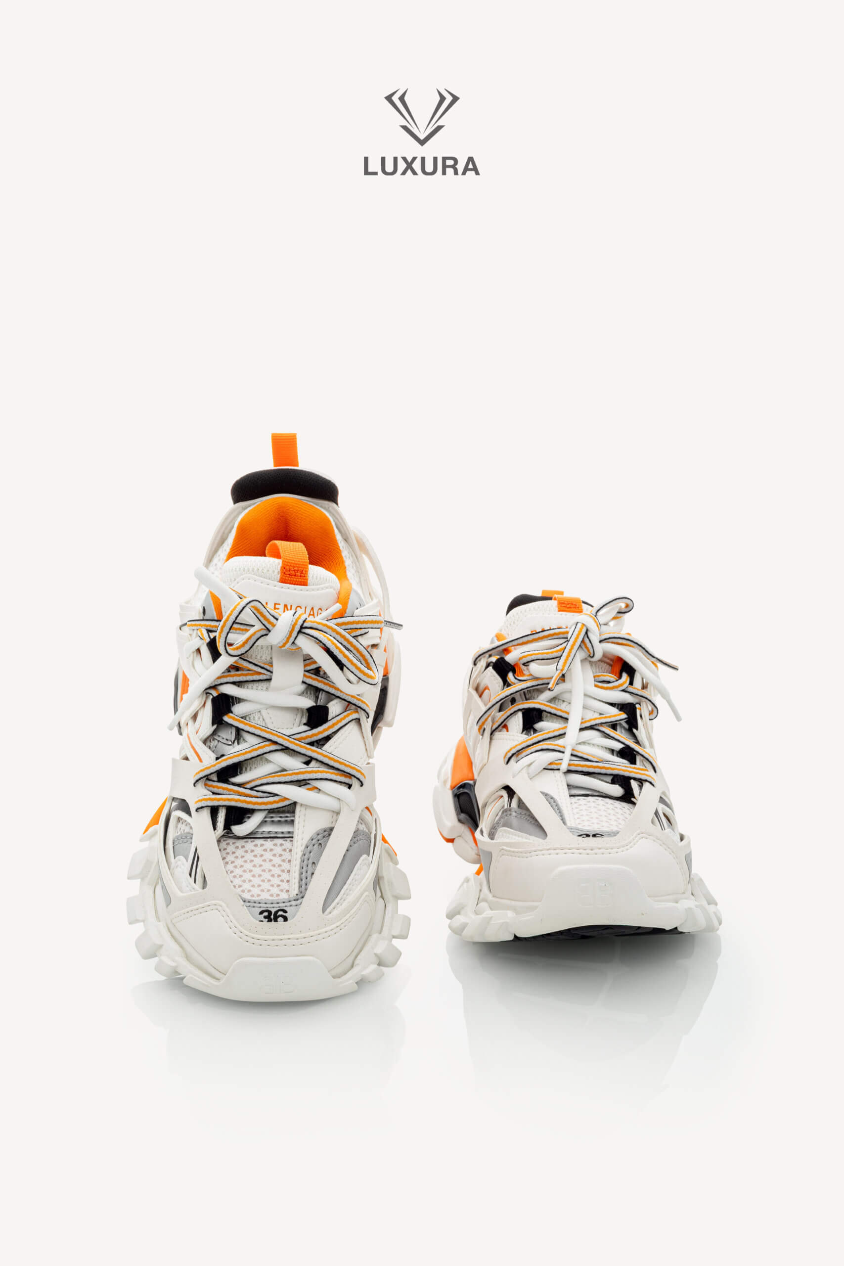 <span style="font-size: 10px;letter-spacing: .15em">IN TRENDING</span><br>            <strong>BALENCIAGA</strong><br>            <div style="margin-top:10px;font-size:16px">Track Sneakers in White and Orange Mesh and Nylon 36 [EXT]</div><br> - Image 4