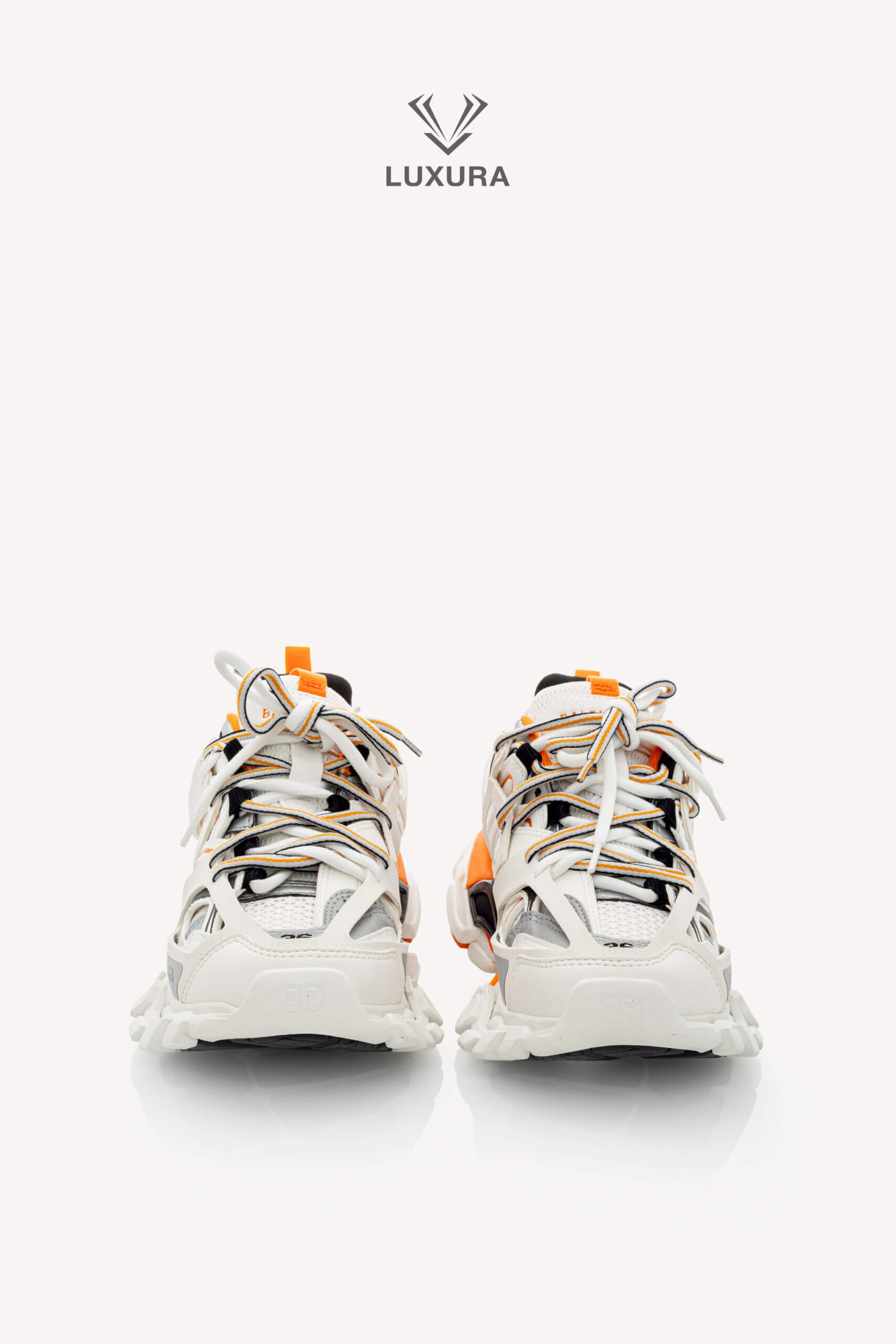 <span style="font-size: 10px;letter-spacing: .15em">IN TRENDING</span><br>            <strong>BALENCIAGA</strong><br>            <div style="margin-top:10px;font-size:16px">Track Sneakers in White and Orange Mesh and Nylon 36 [EXT]</div><br> - Image 6