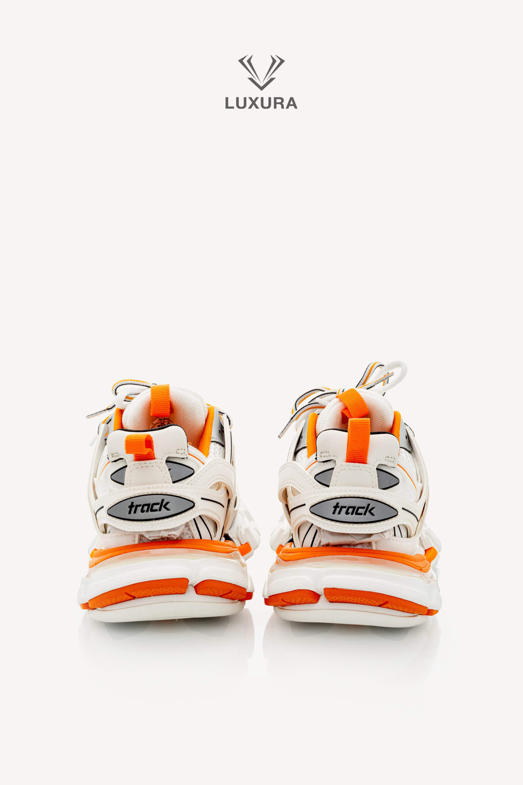 <span style="font-size: 10px;letter-spacing: .15em">IN TRENDING</span><br>            <strong>BALENCIAGA</strong><br>            <div style="margin-top:10px;font-size:16px">Track Sneakers in White and Orange Mesh and Nylon 36 [EXT]</div><br> - Image 7