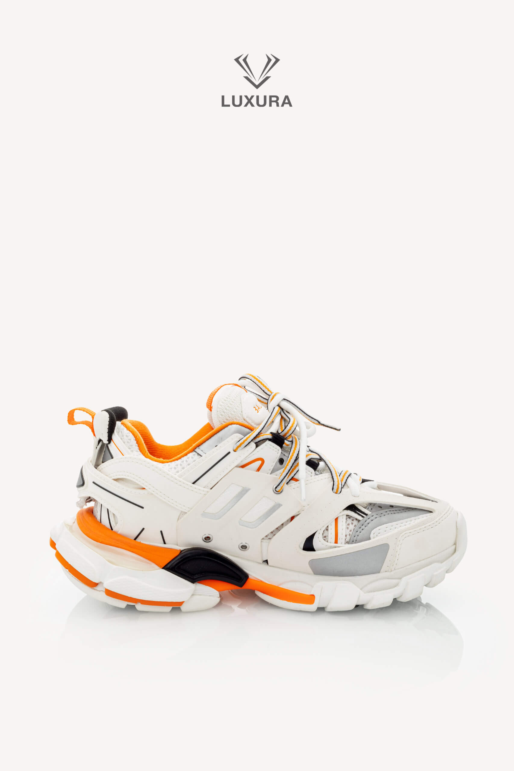 <span style="font-size: 10px;letter-spacing: .15em">IN TRENDING</span><br>            <strong>BALENCIAGA</strong><br>            <div style="margin-top:10px;font-size:16px">Track Sneakers in White and Orange Mesh and Nylon 36 [EXT]</div><br> - Image 11