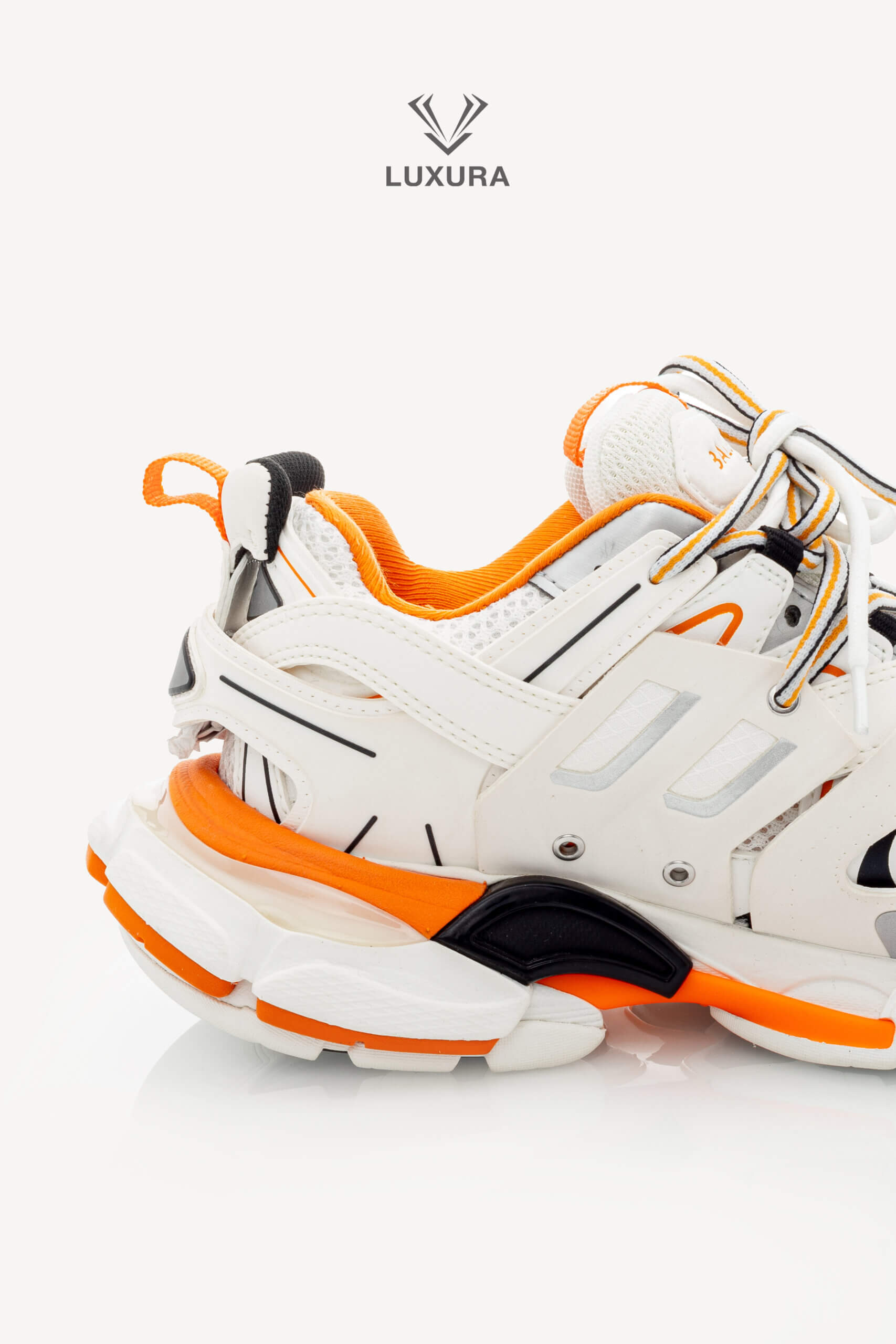 <span style="font-size: 10px;letter-spacing: .15em">IN TRENDING</span><br>            <strong>BALENCIAGA</strong><br>            <div style="margin-top:10px;font-size:16px">Track Sneakers in White and Orange Mesh and Nylon 36 [EXT]</div><br> - Image 14