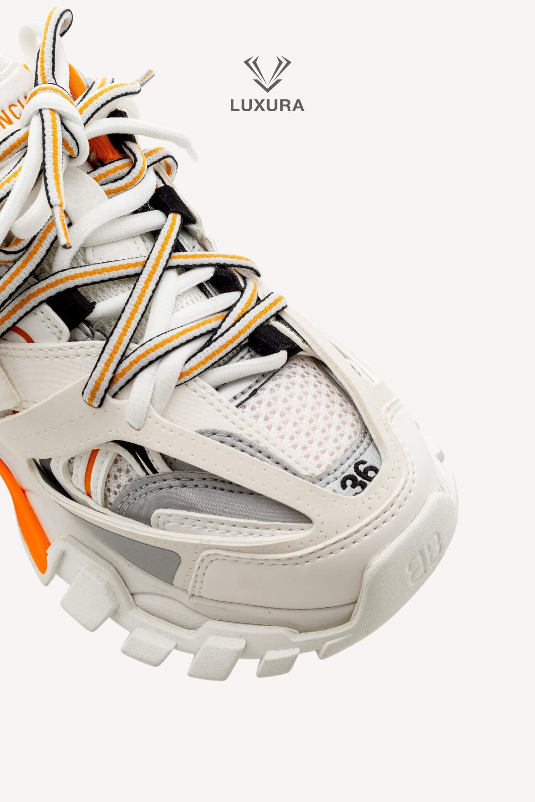 <span style="font-size: 10px;letter-spacing: .15em">IN TRENDING</span><br>            <strong>BALENCIAGA</strong><br>            <div style="margin-top:10px;font-size:16px">Track Sneakers in White and Orange Mesh and Nylon 36 [EXT]</div><br> - Image 12