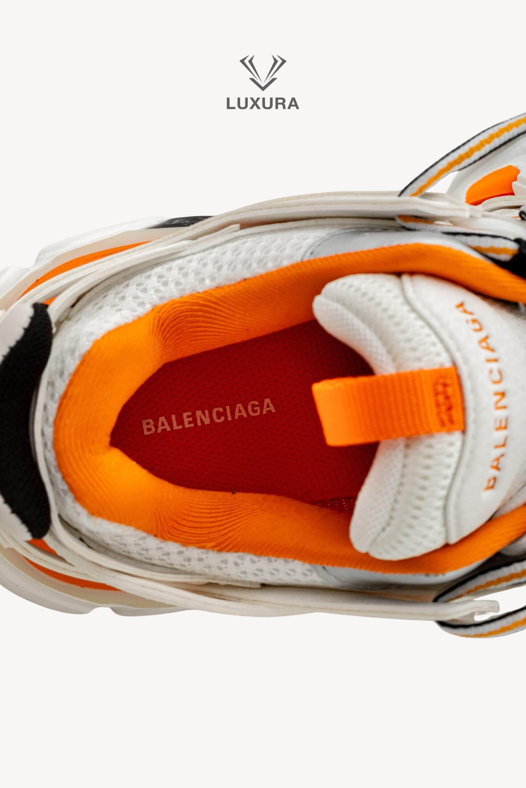 <span style="font-size: 10px;letter-spacing: .15em">IN TRENDING</span><br>            <strong>BALENCIAGA</strong><br>            <div style="margin-top:10px;font-size:16px">Track Sneakers in White and Orange Mesh and Nylon 36 [EXT]</div><br> - Image 21