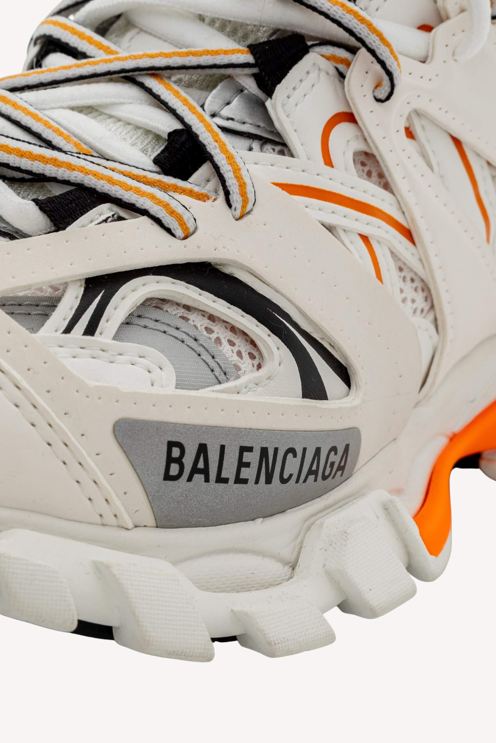 <span style="font-size: 10px;letter-spacing: .15em">IN TRENDING</span><br>            <strong>BALENCIAGA</strong><br>            <div style="margin-top:10px;font-size:16px">Track Sneakers in White and Orange Mesh and Nylon 36 [EXT]</div><br> - Image 20