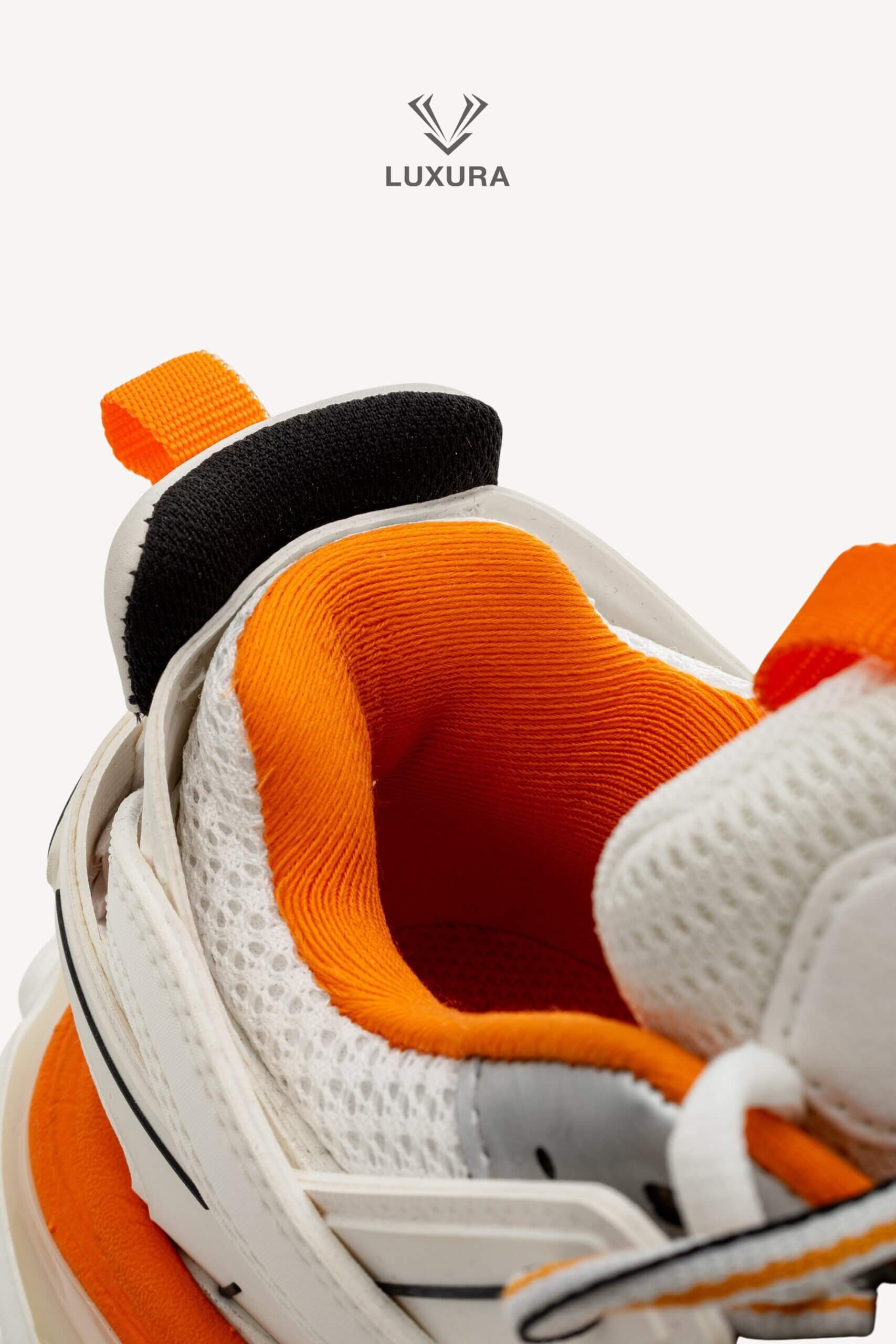 <span style="font-size: 10px;letter-spacing: .15em">IN TRENDING</span><br>            <strong>BALENCIAGA</strong><br>            <div style="margin-top:10px;font-size:16px">Track Sneakers in White and Orange Mesh and Nylon 36 [EXT]</div><br> - Image 22