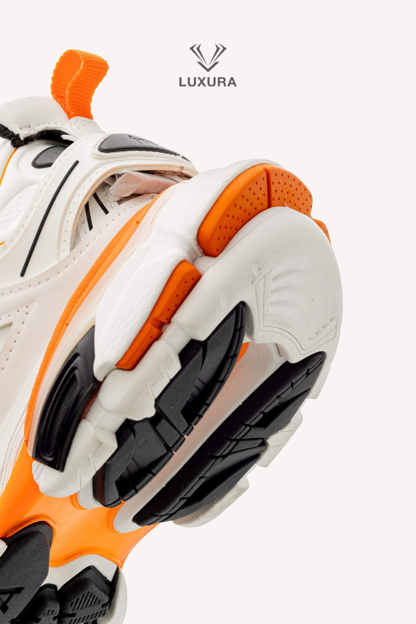 <span style="font-size: 10px;letter-spacing: .15em">IN TRENDING</span><br>            <strong>BALENCIAGA</strong><br>            <div style="margin-top:10px;font-size:16px">Track Sneakers in White and Orange Mesh and Nylon 36 [EXT]</div><br> - Image 24