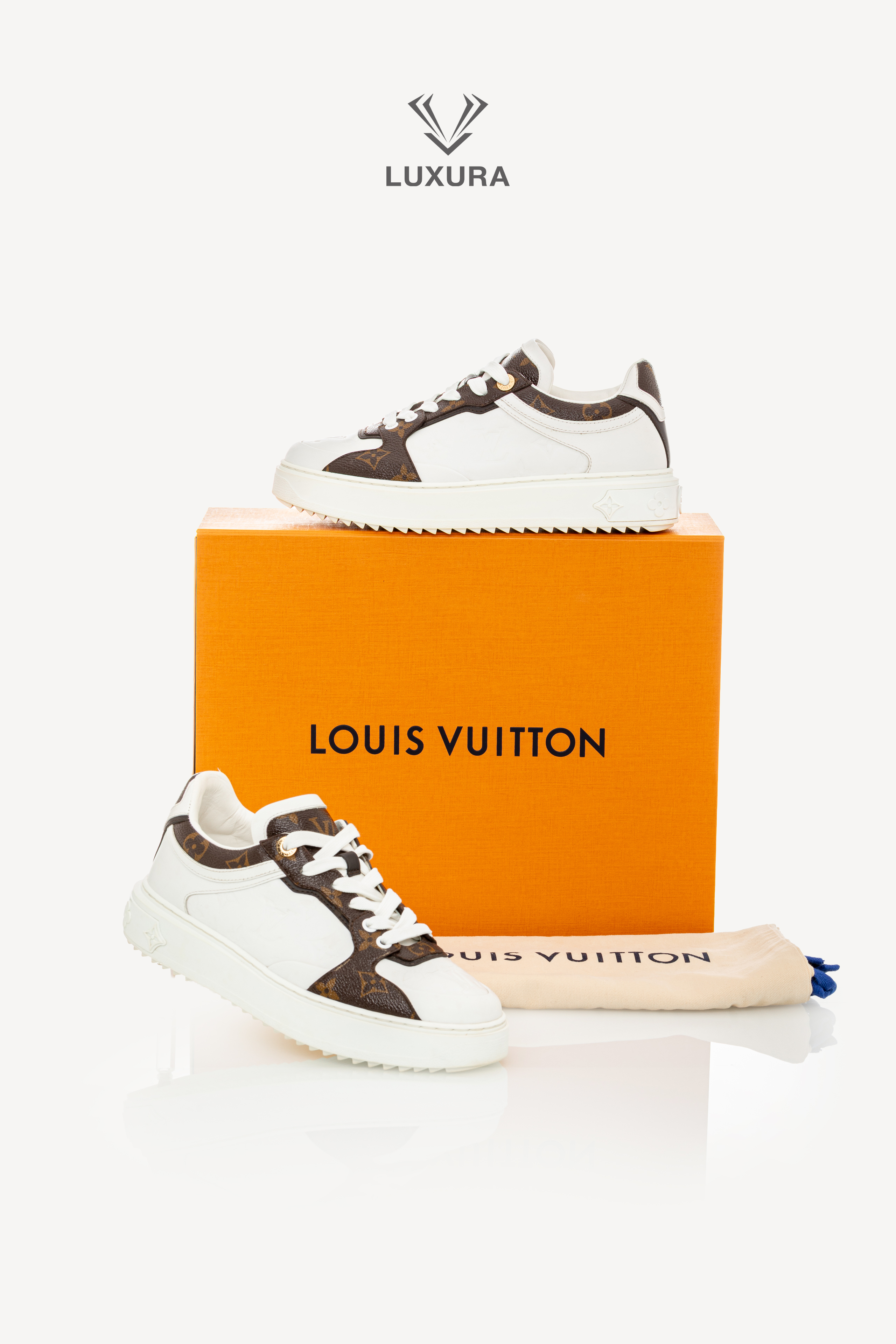 <span style="font-size: 10px;letter-spacing: .15em">BEST DEAL</span><br>            <strong>LOUIS VUITTON</strong><br>            <div style="margin-top:10px;font-size:16px">Calfskin Embossed Monogram Time Out Sneakers White 39</div><br> - Image 2