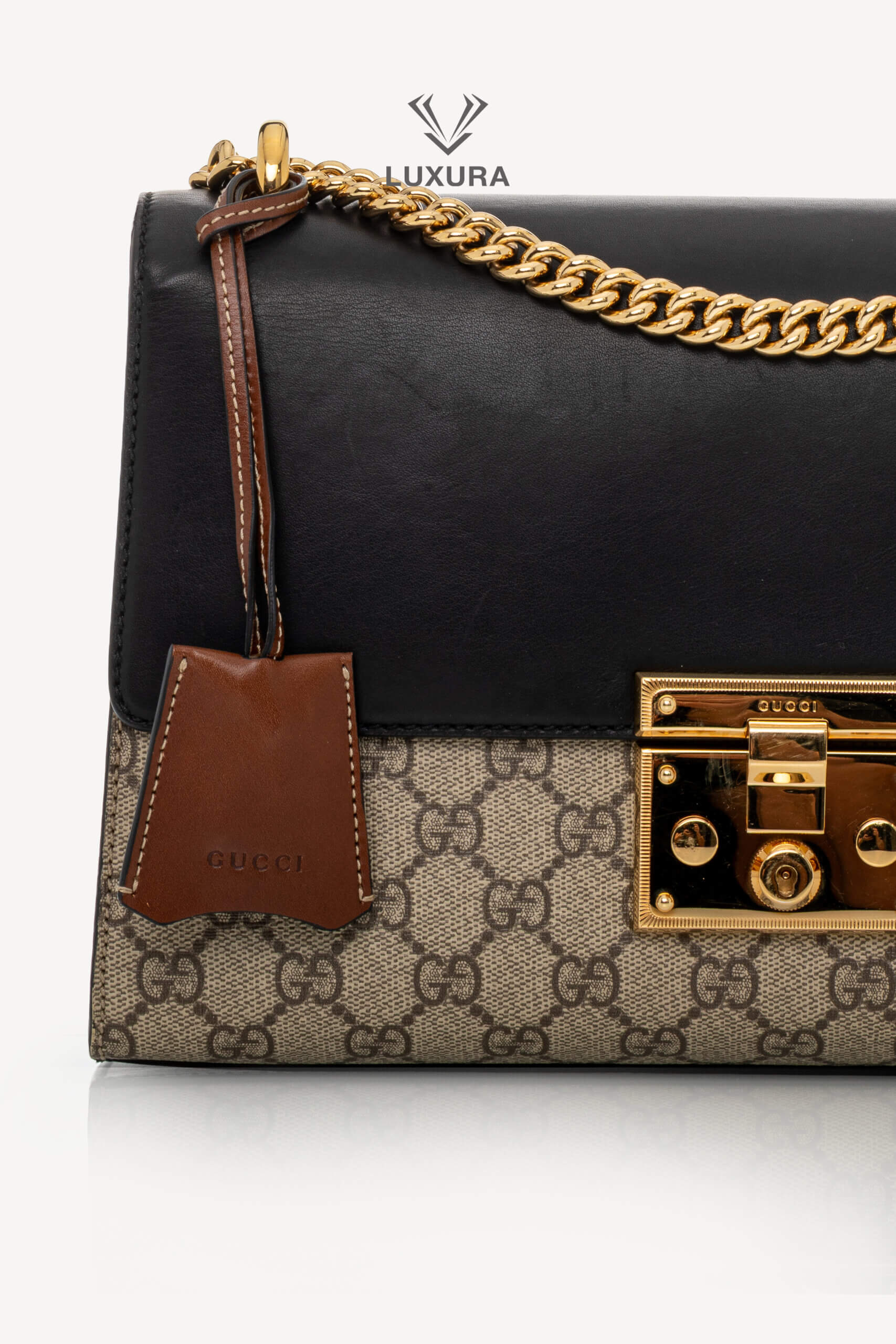 <span style="font-size: 10px;letter-spacing: .15em">IN TRENDING</span><br> <strong>GUCCI</strong><br> <div style="margin-top:10px;font-size:16px">Supreme Monogram Calfskin Medium Padlock Shoulder Bag Brown Black</div><br> - Image 6