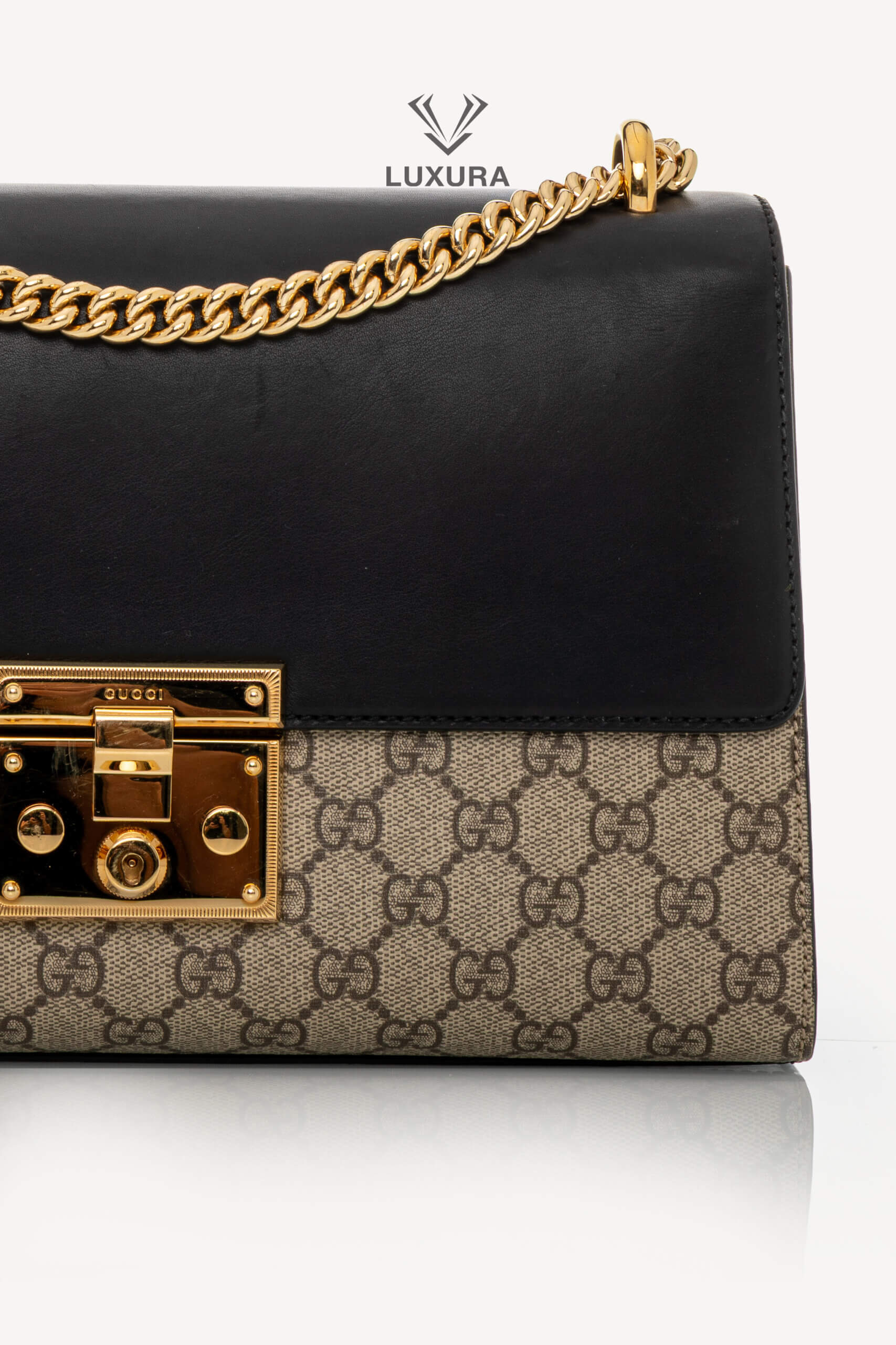 <span style="font-size: 10px;letter-spacing: .15em">IN TRENDING</span><br> <strong>GUCCI</strong><br> <div style="margin-top:10px;font-size:16px">Supreme Monogram Calfskin Medium Padlock Shoulder Bag Brown Black</div><br> - Image 7