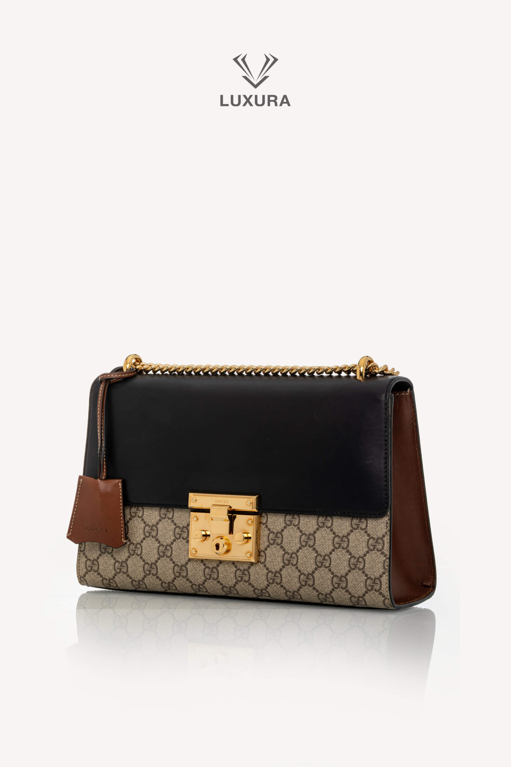 <span style="font-size: 10px;letter-spacing: .15em">IN TRENDING</span><br> <strong>GUCCI</strong><br> <div style="margin-top:10px;font-size:16px">Supreme Monogram Calfskin Medium Padlock Shoulder Bag Brown Black</div><br> - Image 10