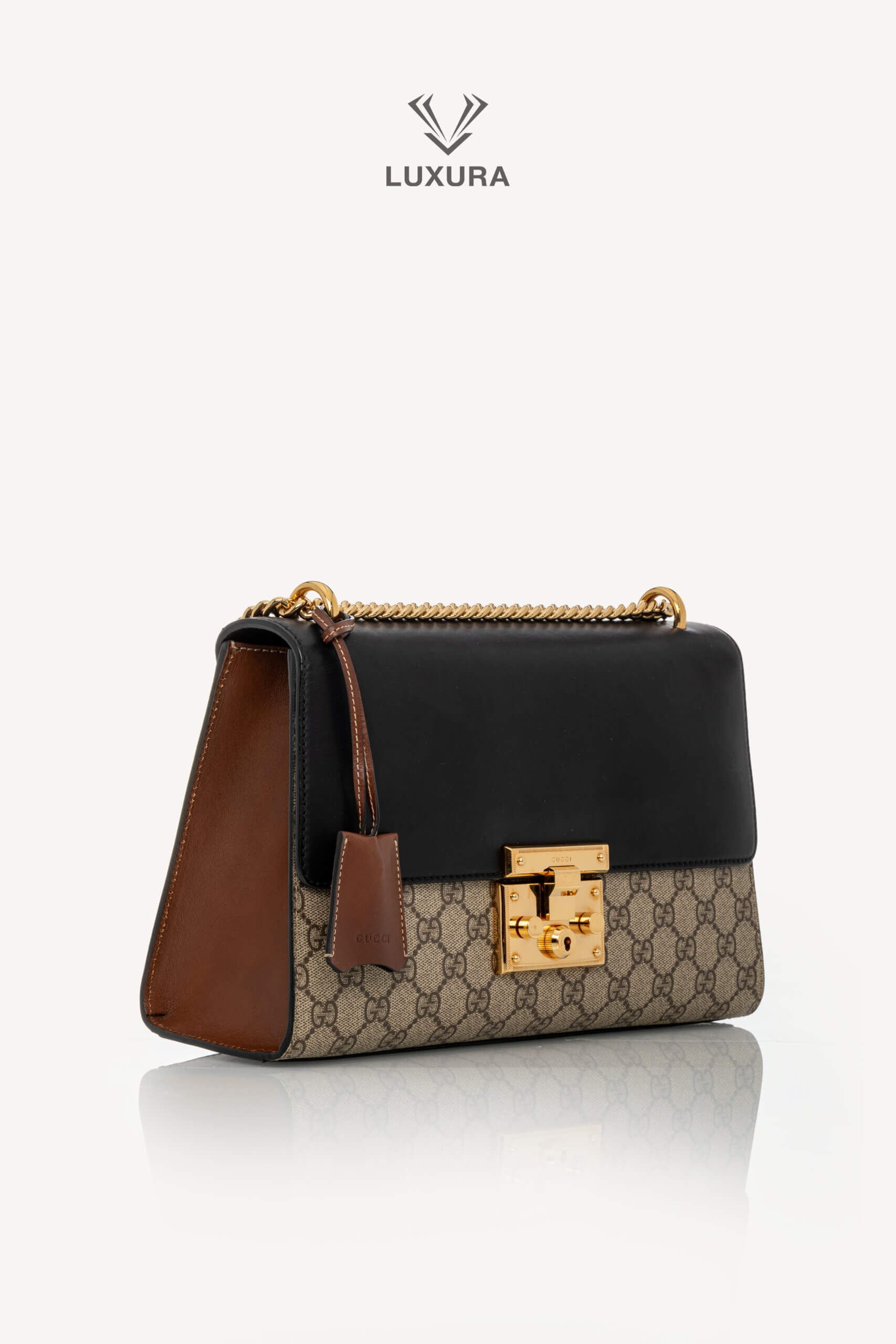 <span style="font-size: 10px;letter-spacing: .15em">IN TRENDING</span><br> <strong>GUCCI</strong><br> <div style="margin-top:10px;font-size:16px">Supreme Monogram Calfskin Medium Padlock Shoulder Bag Brown Black</div><br> - Image 3