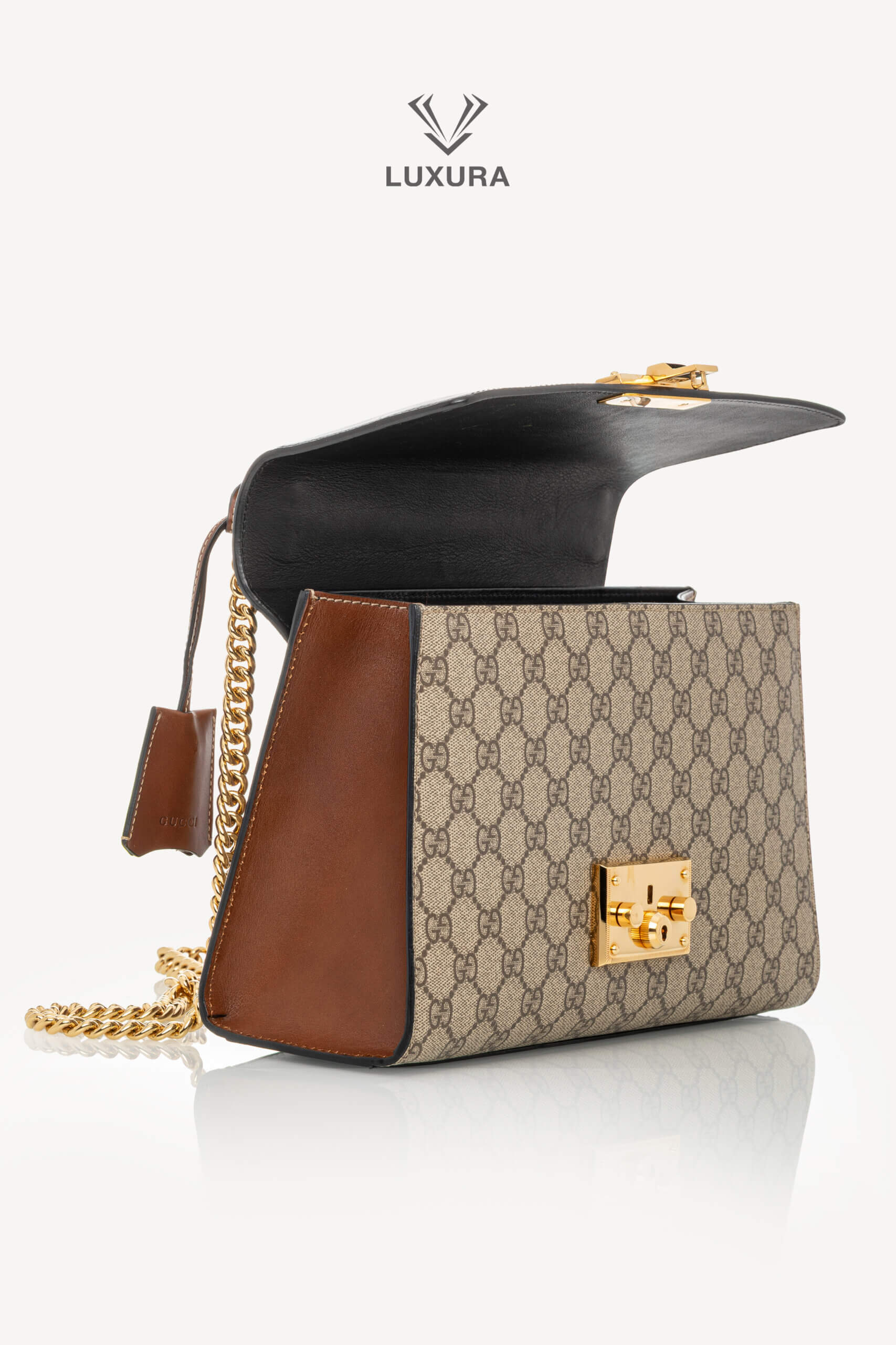 <span style="font-size: 10px;letter-spacing: .15em">IN TRENDING</span><br> <strong>GUCCI</strong><br> <div style="margin-top:10px;font-size:16px">Supreme Monogram Calfskin Medium Padlock Shoulder Bag Brown Black</div><br> - Image 9