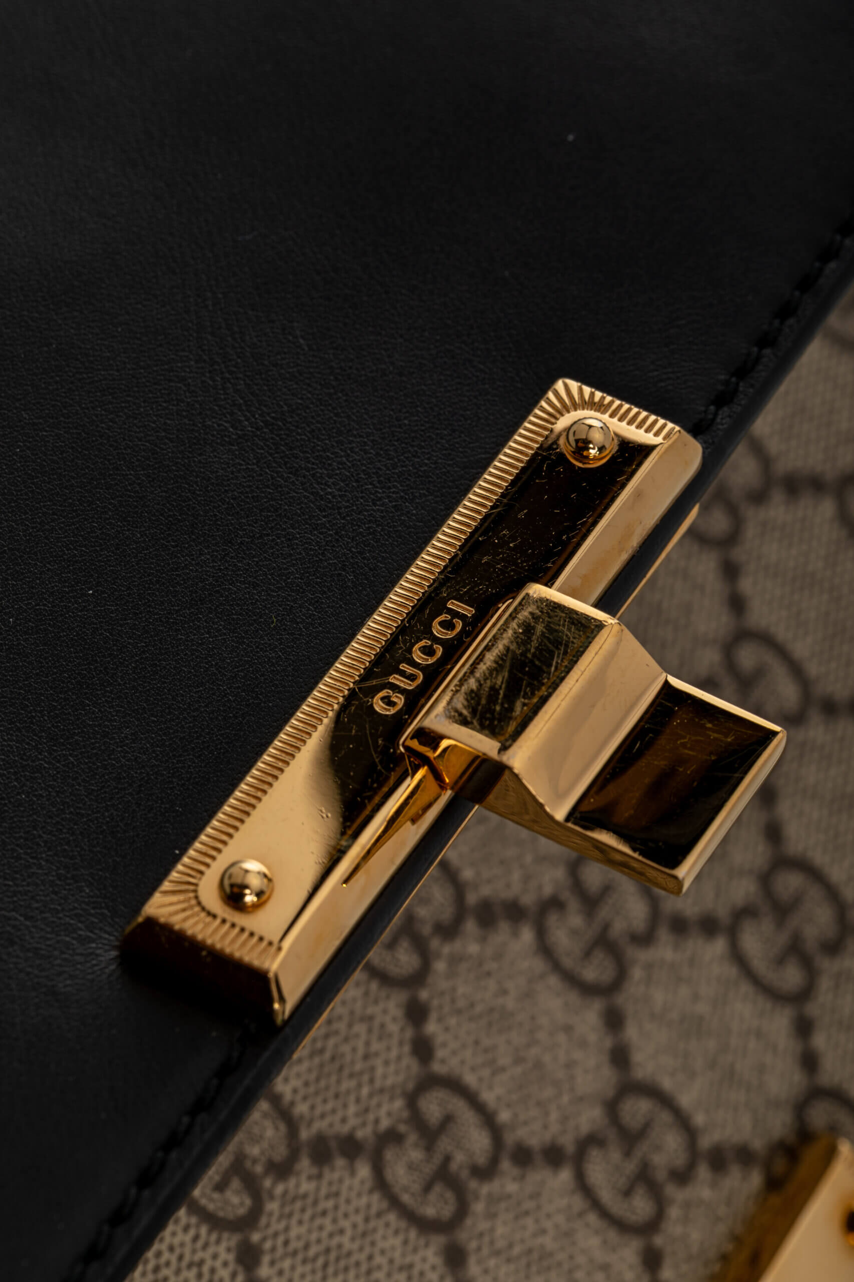 <span style="font-size: 10px;letter-spacing: .15em">IN TRENDING</span><br> <strong>GUCCI</strong><br> <div style="margin-top:10px;font-size:16px">Supreme Monogram Calfskin Medium Padlock Shoulder Bag Brown Black</div><br> - Image 19