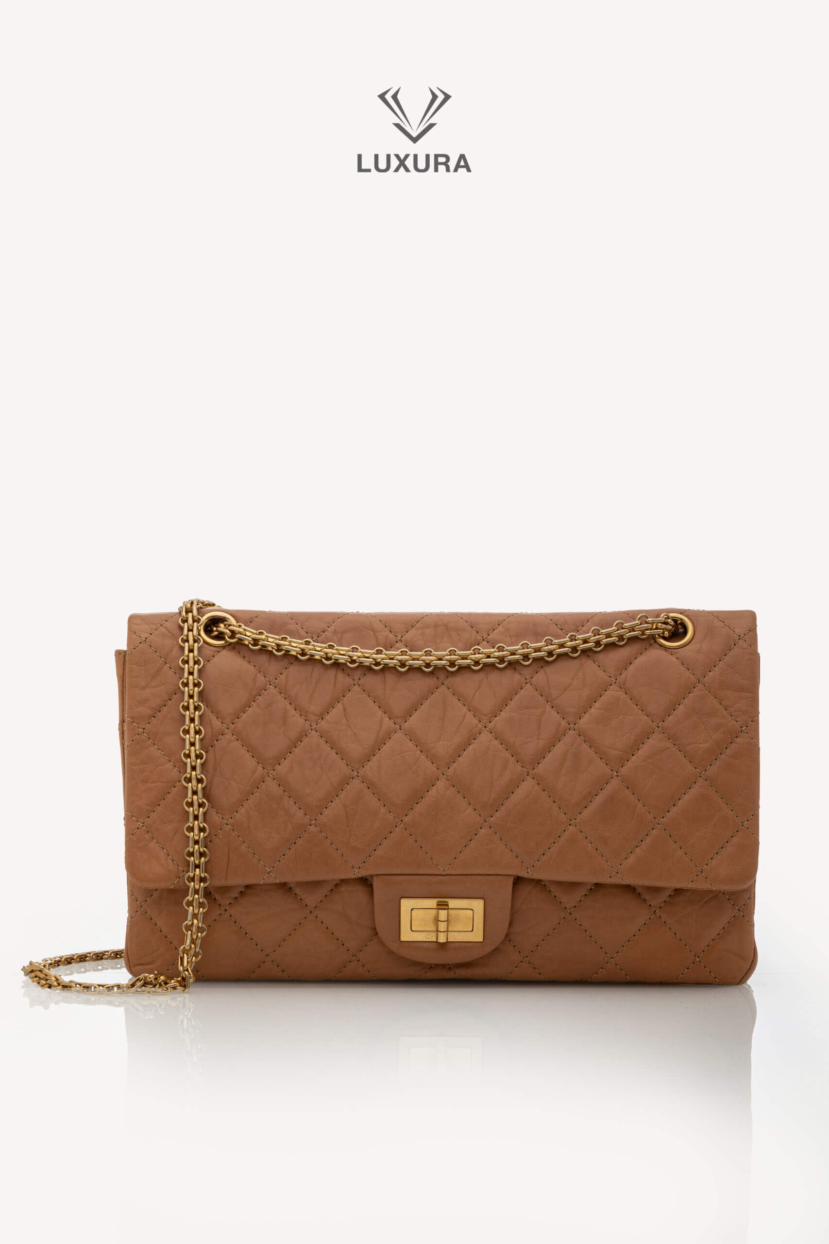 <span style="font-size: 10px;letter-spacing: .15em">HARD TO FIND</span><br><strong>CHANEL</strong><br><div style="margin-top:10px;font-size:16px">2.55 Dark Beige Distressed Calf with Gold Hardware</div><br>