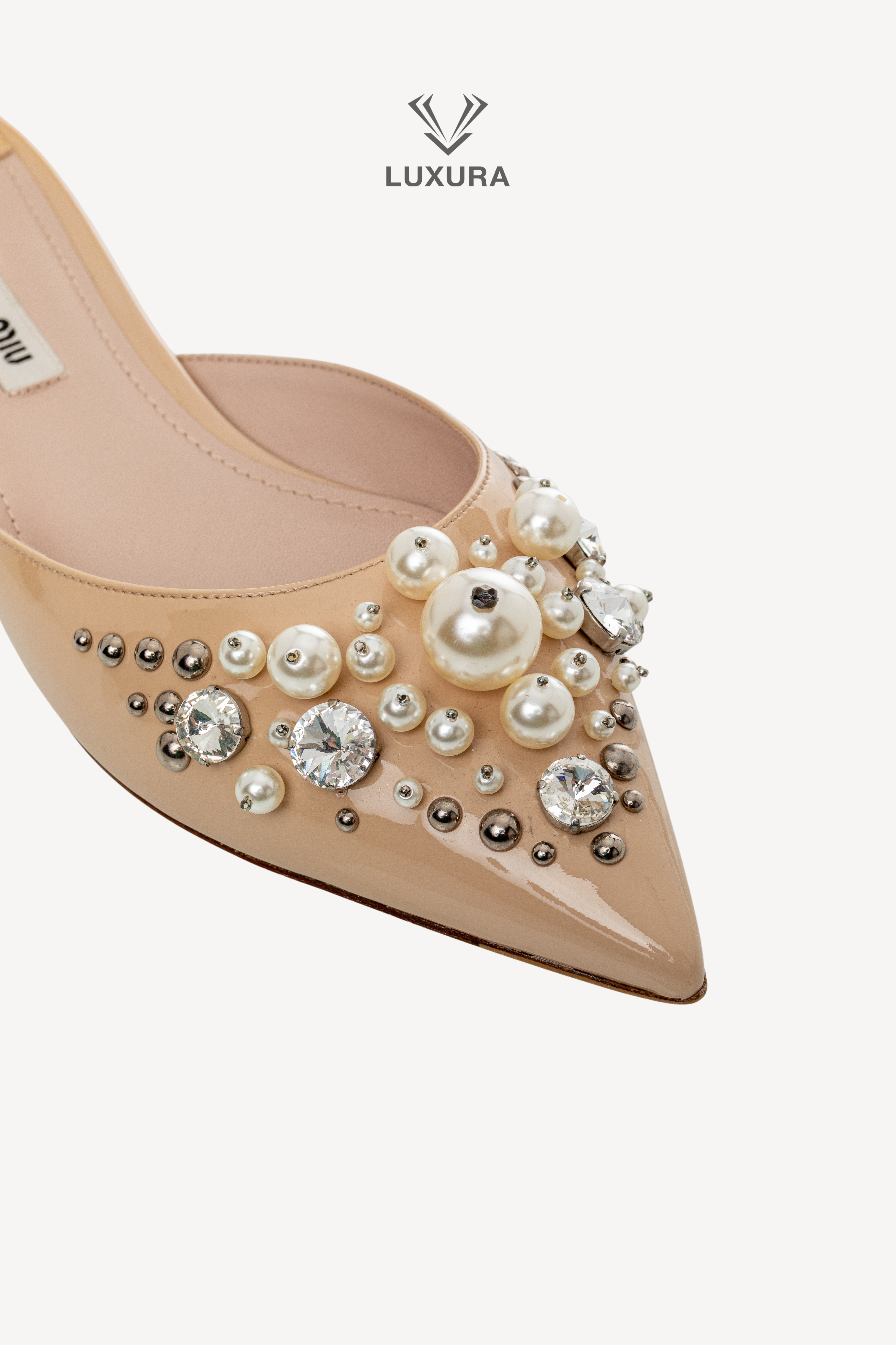 <span style="font-size: 10px;letter-spacing: .15em">BEST DEAL</span><br> <strong>MIU MIU</strong><br> <div style="margin-top:10px;font-size:16px">Patent Leather Faux Pearl Embellished Pointed Toe Mules Nude 37.5</div><br> - Image 3