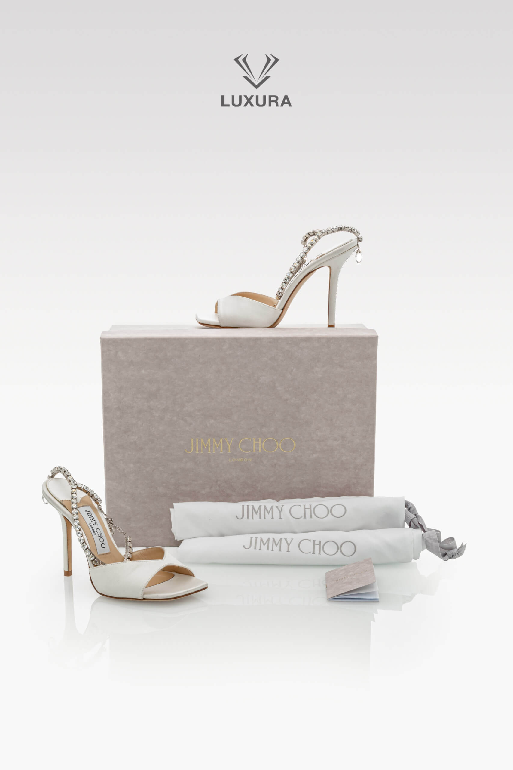 <span style="font-size: 10px;letter-spacing: .15em"></span><br>
<strong>JIMMY CHOO</strong><br>
<div style="margin-top:10px;font-size:16px">Saeda 85 Crystal Embellished Satin Sandals Ivory 35.5</div><br> - Image 13