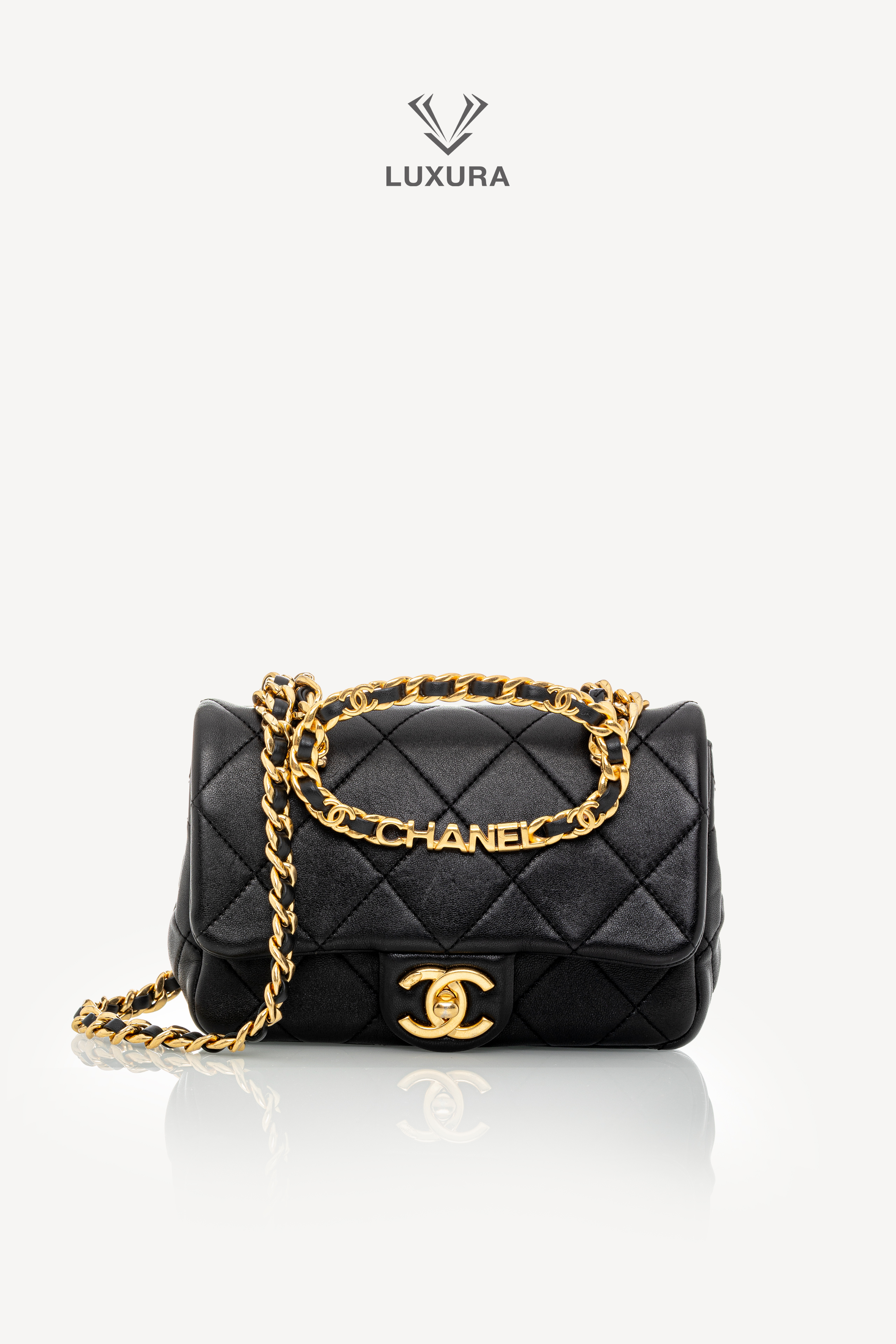 <span style="font-size: 10px;letter-spacing: .15em">HARD TO FIND</span><br>            <strong>CHANEL</strong><br>            <div style="margin-top:10px;font-size:16px">Mini Quilted Lambskin Round Top Handle Flap Bag Black</div><br>