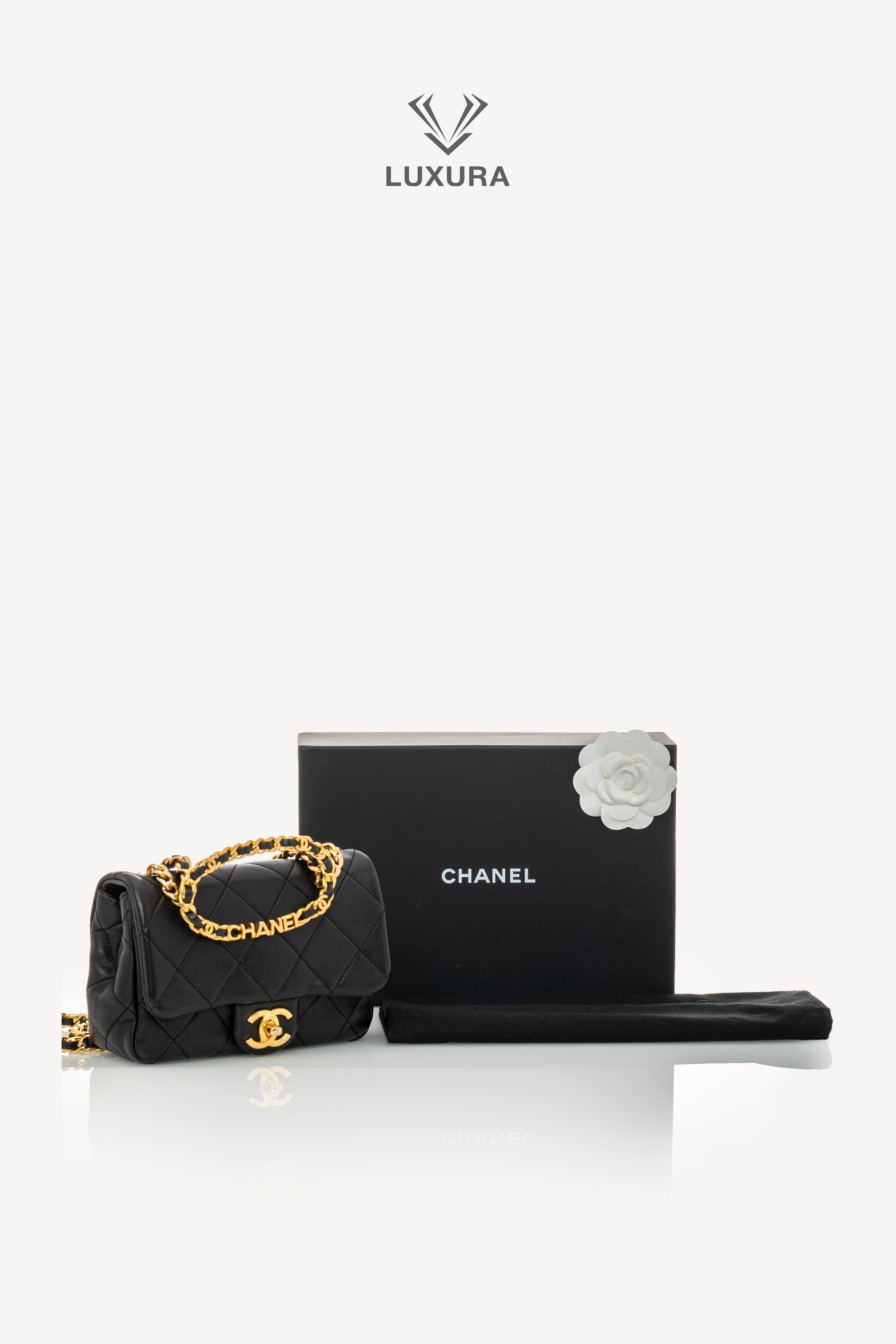 <span style="font-size: 10px;letter-spacing: .15em">HARD TO FIND</span><br>            <strong>CHANEL</strong><br>            <div style="margin-top:10px;font-size:16px">Mini Quilted Lambskin Round Top Handle Flap Bag Black</div><br> - Image 2