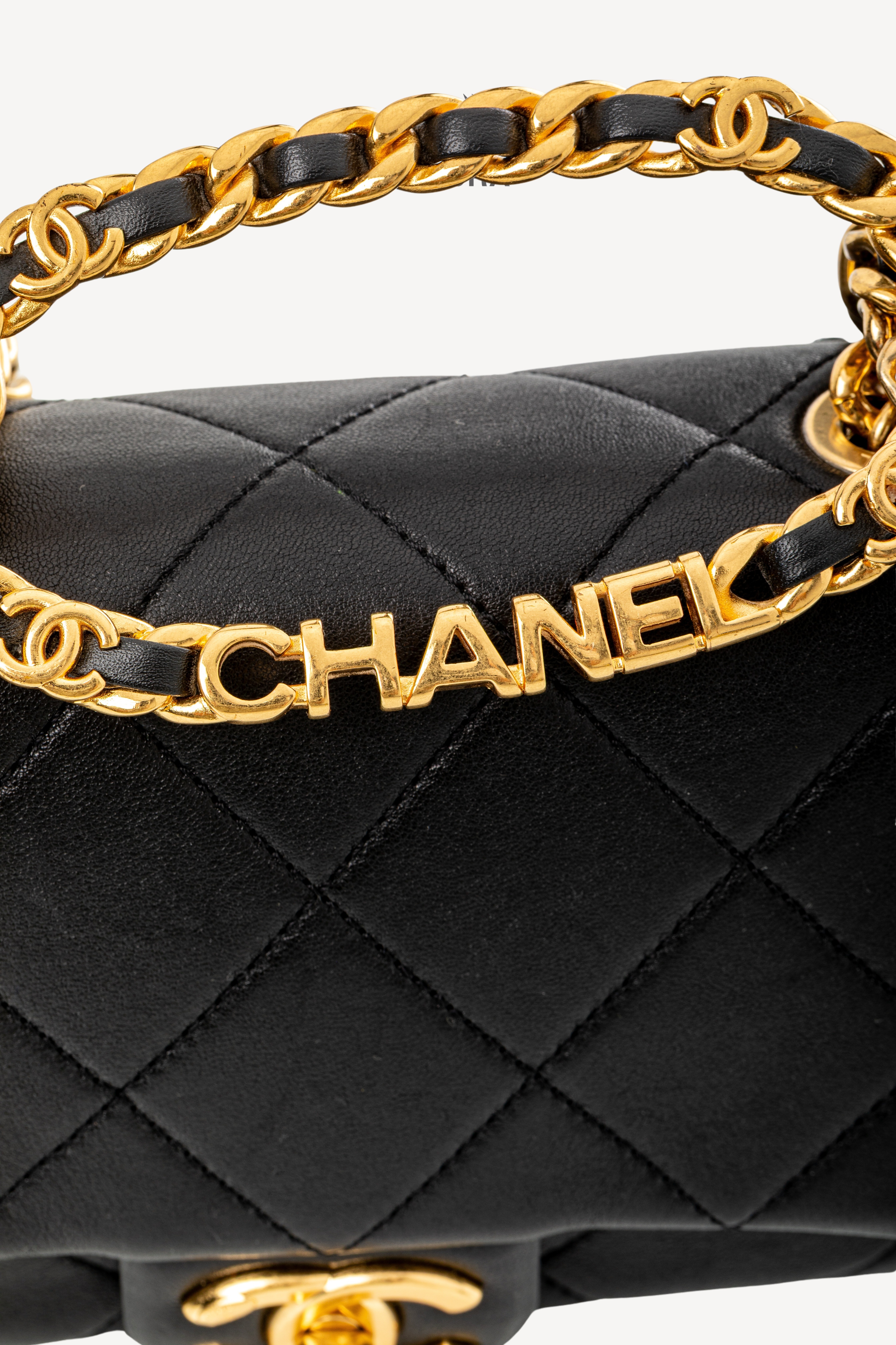 <span style="font-size: 10px;letter-spacing: .15em">HARD TO FIND</span><br>            <strong>CHANEL</strong><br>            <div style="margin-top:10px;font-size:16px">Mini Quilted Lambskin Round Top Handle Flap Bag Black</div><br> - Image 19