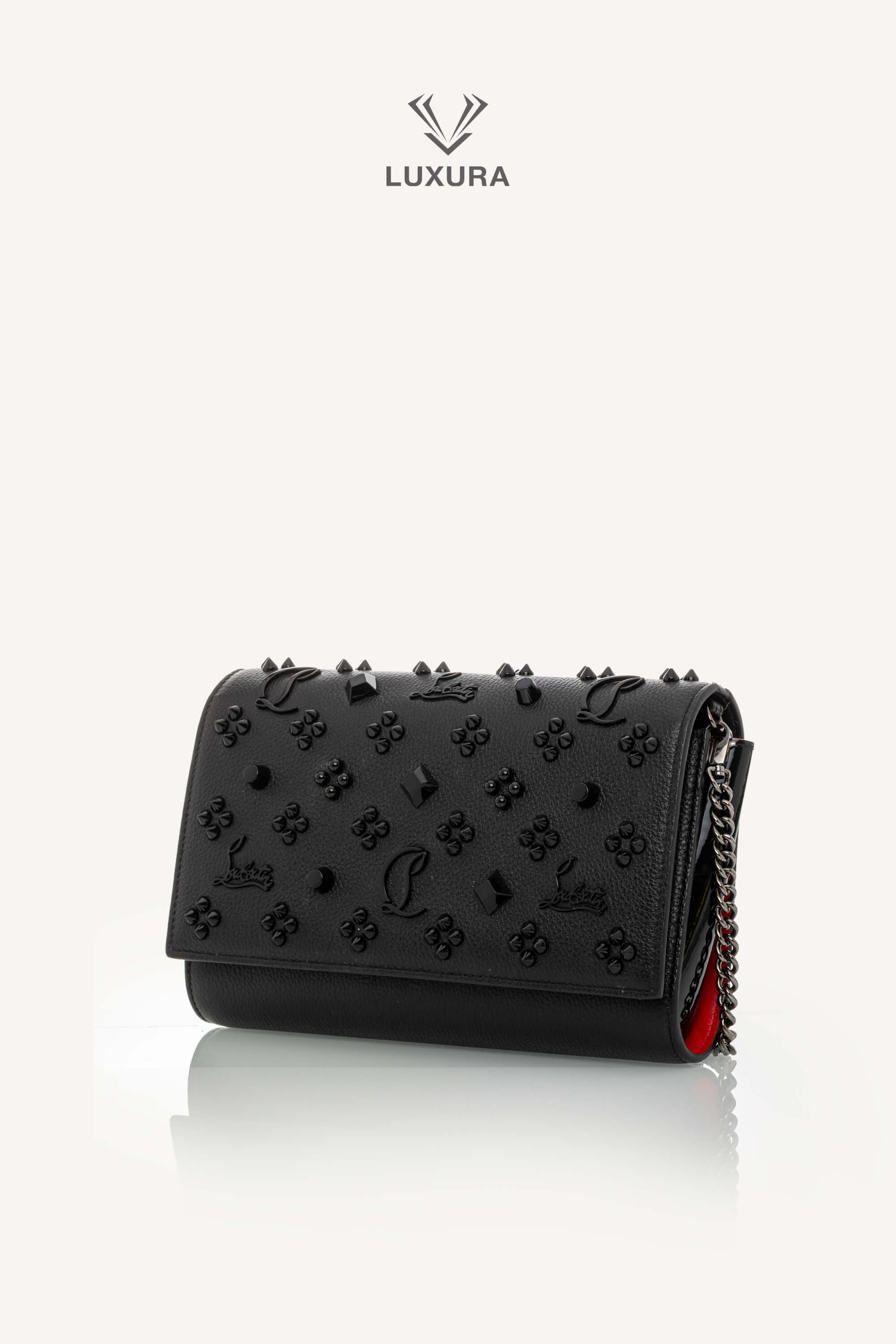 <span style="font-size: 10px;letter-spacing: .15em">BEST DEAL</span><br>            <strong>CHRISTIAN LOUBOUTIN</strong><br>            <div style="margin-top:10px;font-size:16px">Paloma Clutch Grained Calf Leather and Spikes Loubinthesky Black</div><br> - Image 8