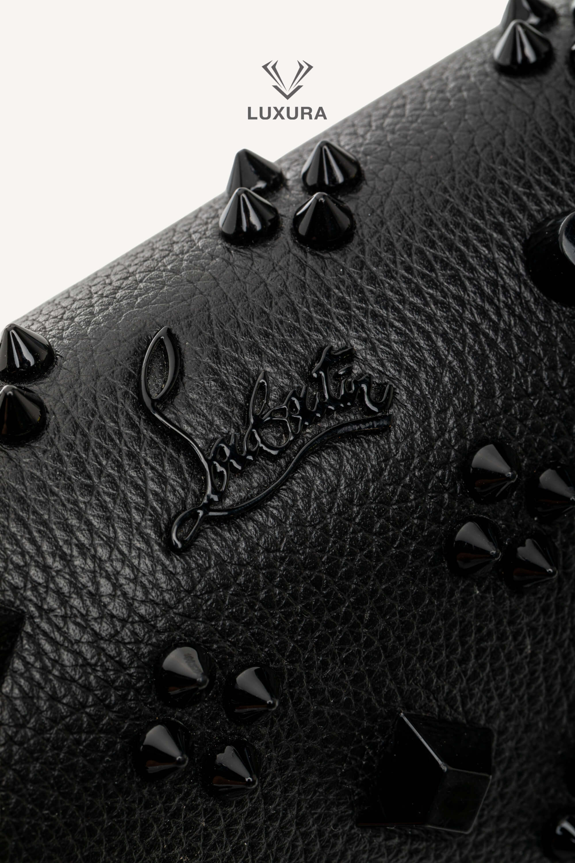 <span style="font-size: 10px;letter-spacing: .15em">BEST DEAL</span><br>            <strong>CHRISTIAN LOUBOUTIN</strong><br>            <div style="margin-top:10px;font-size:16px">Paloma Clutch Grained Calf Leather and Spikes Loubinthesky Black</div><br> - Image 12